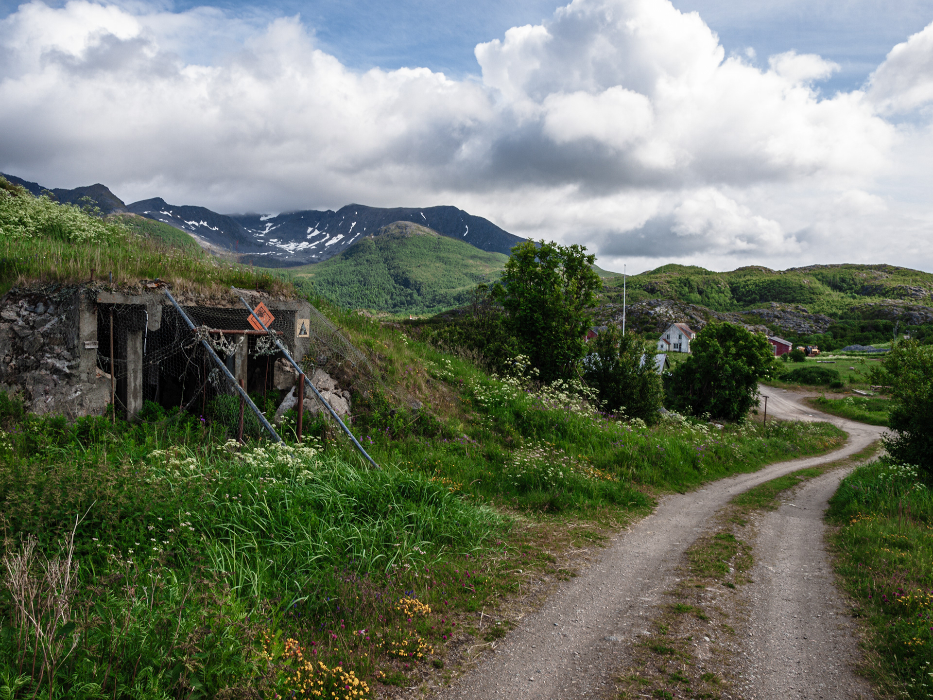 A road passes by an entrance to a bunker at an old German WWII battery in Skrolsvik