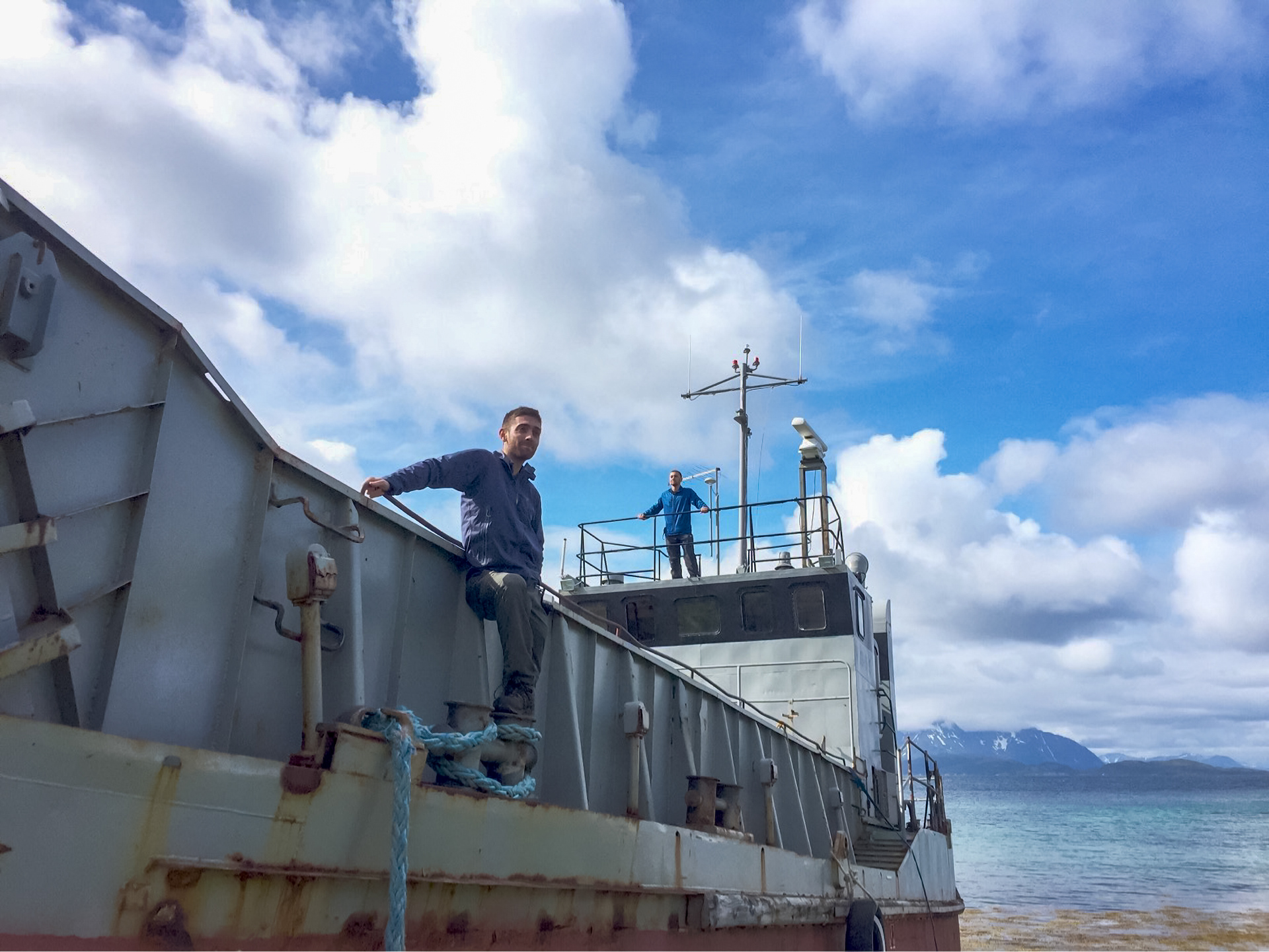 Rob and Nick pose on a beached ship in Skrolsvik