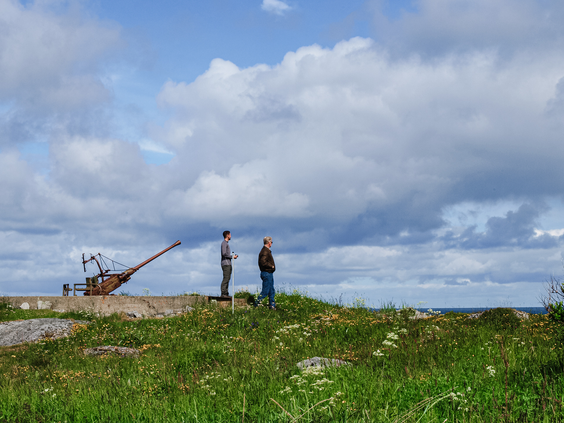 Rob and Bob scan the horizon while exploring an old German WWII battery in Skrolsvik