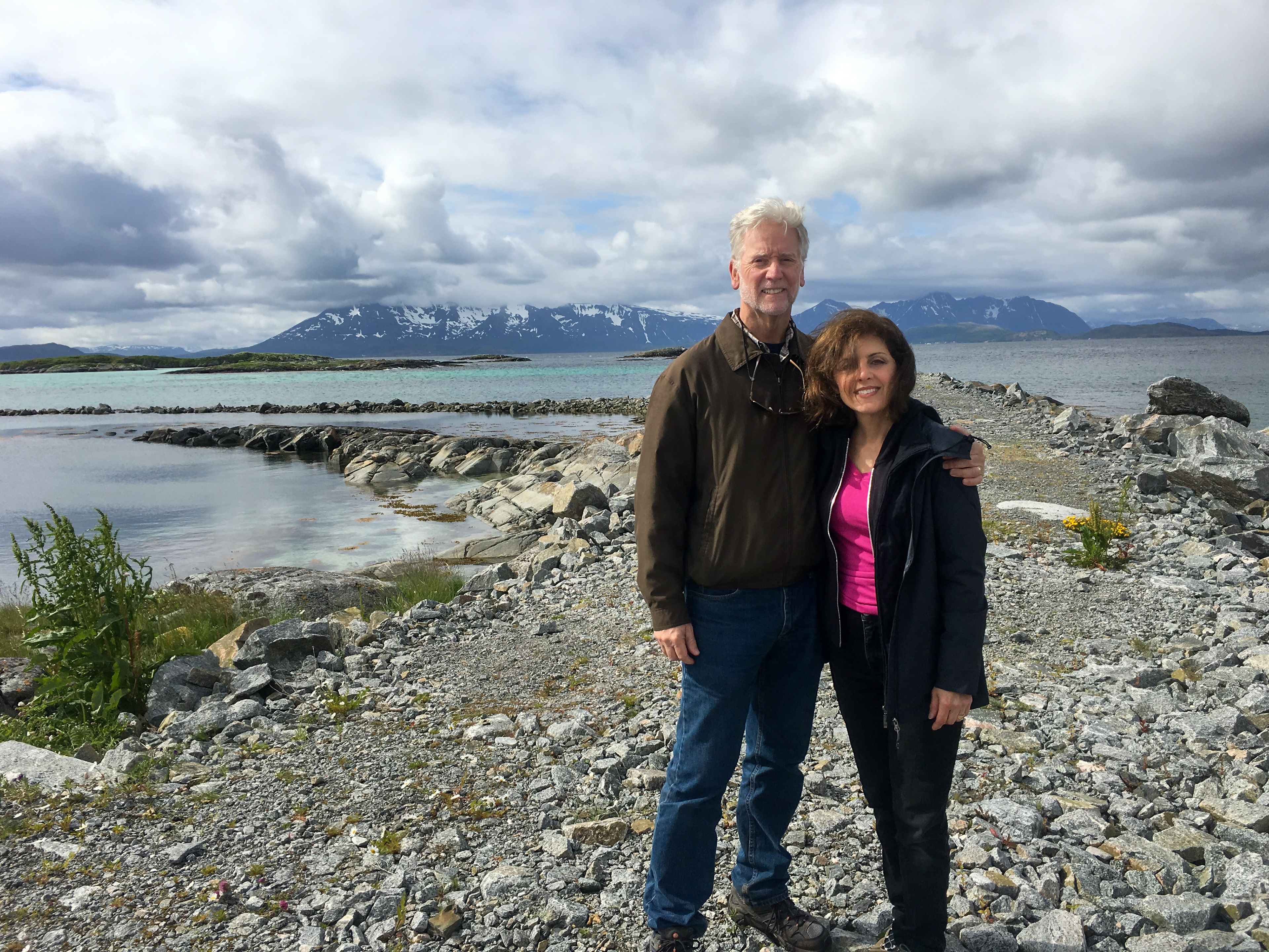 Bob and Paula pose on a rocky pathway in Skrolsvik