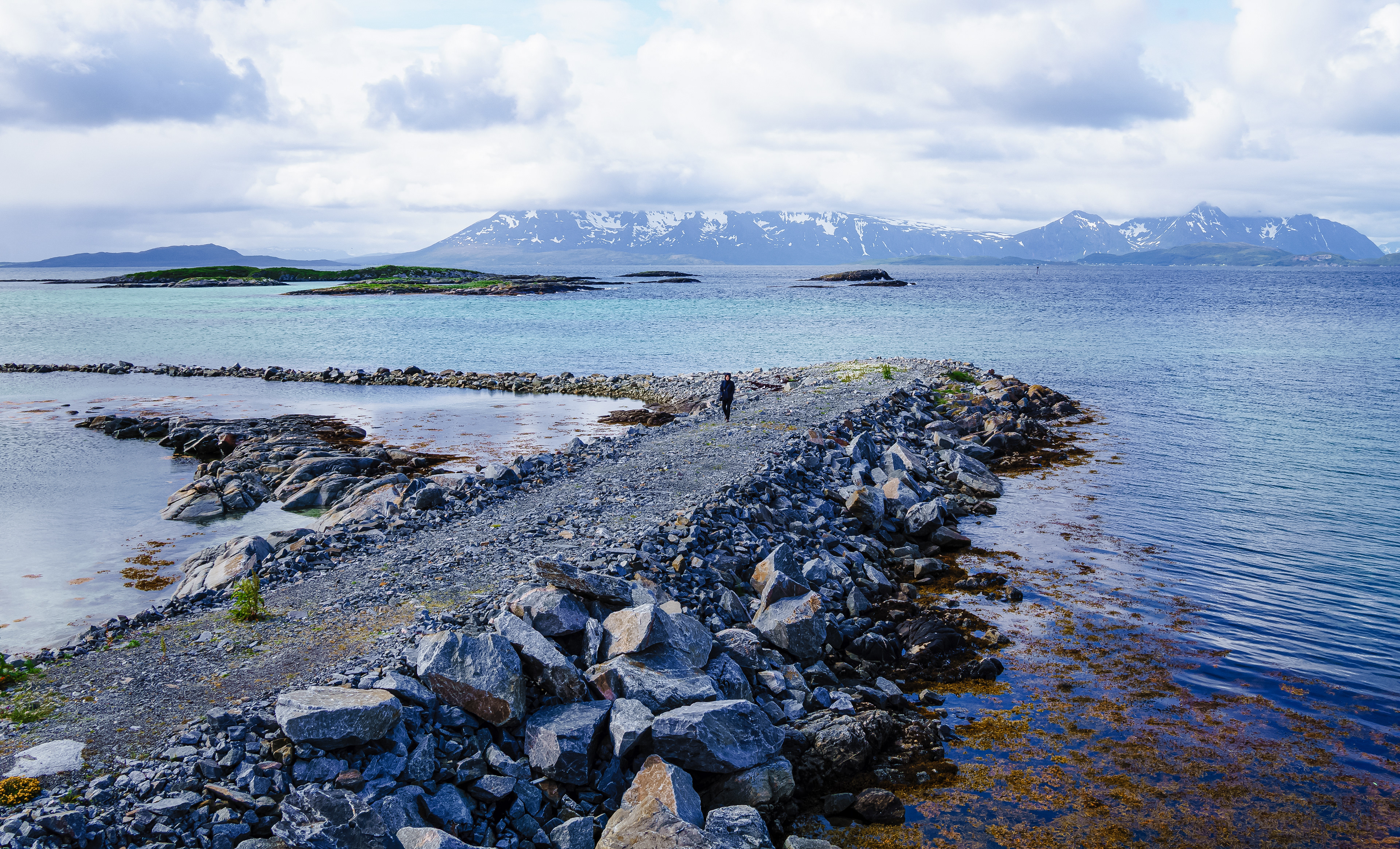 Paula walks along a rocky pathway in Skrolsvik
