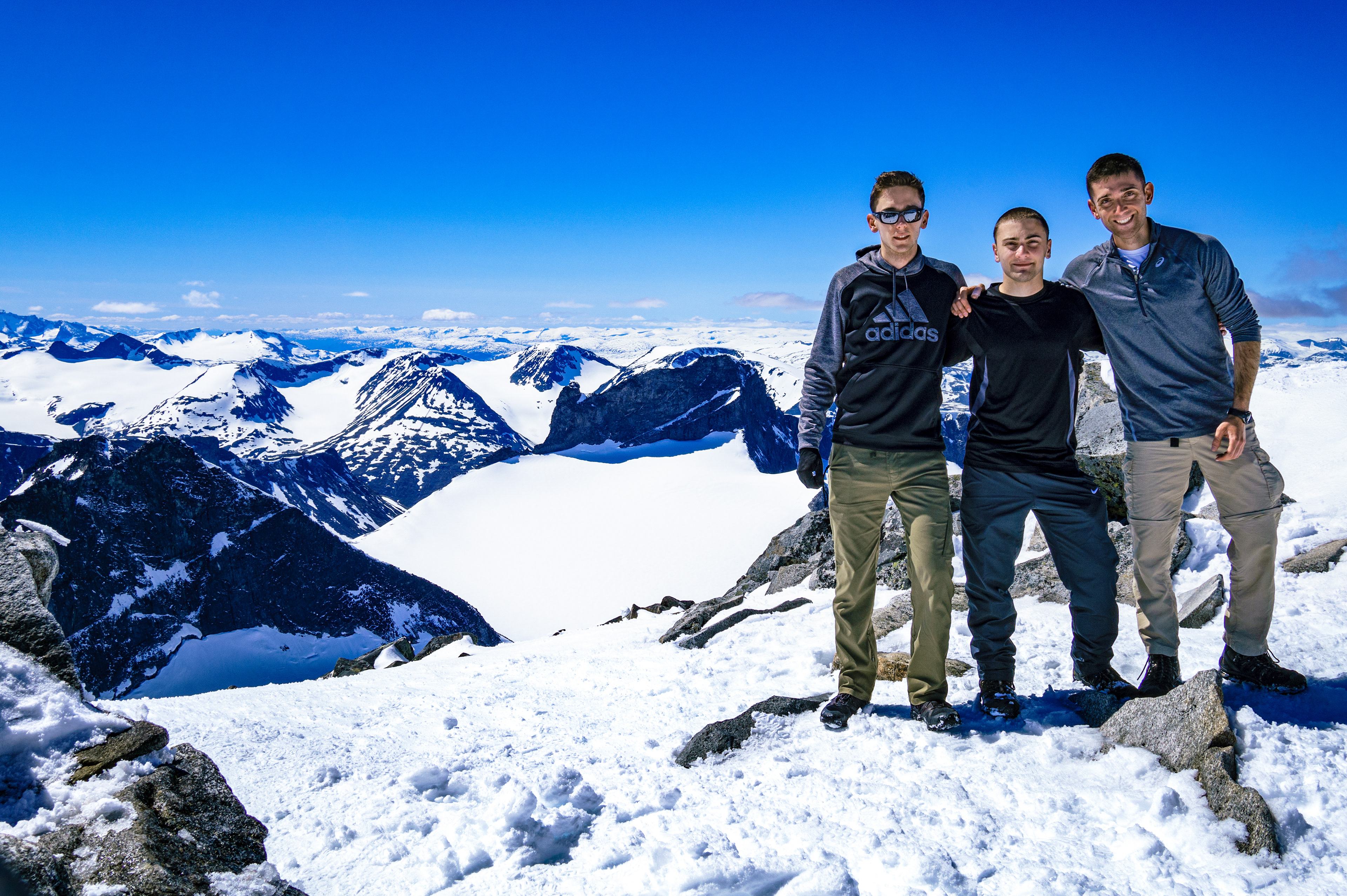 James, Nick, and Rob posing at the summit of Galdhøpiggen ("peak of the steep and rounded mountain")
