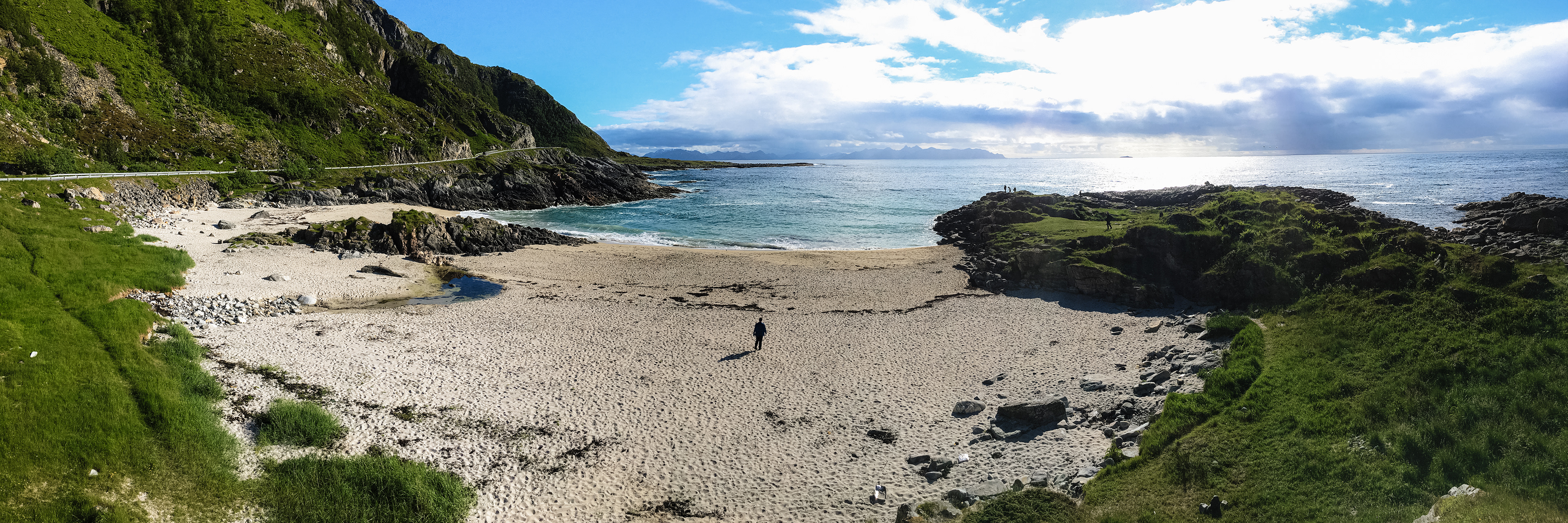 Nick walks out to the shoreline on a secluded beach along the road west to the tip of Lofoten