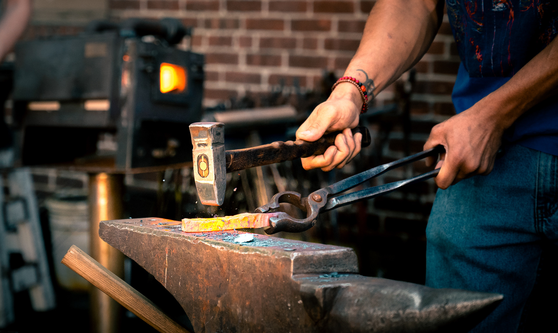 A blacksmith working at stART on the Street