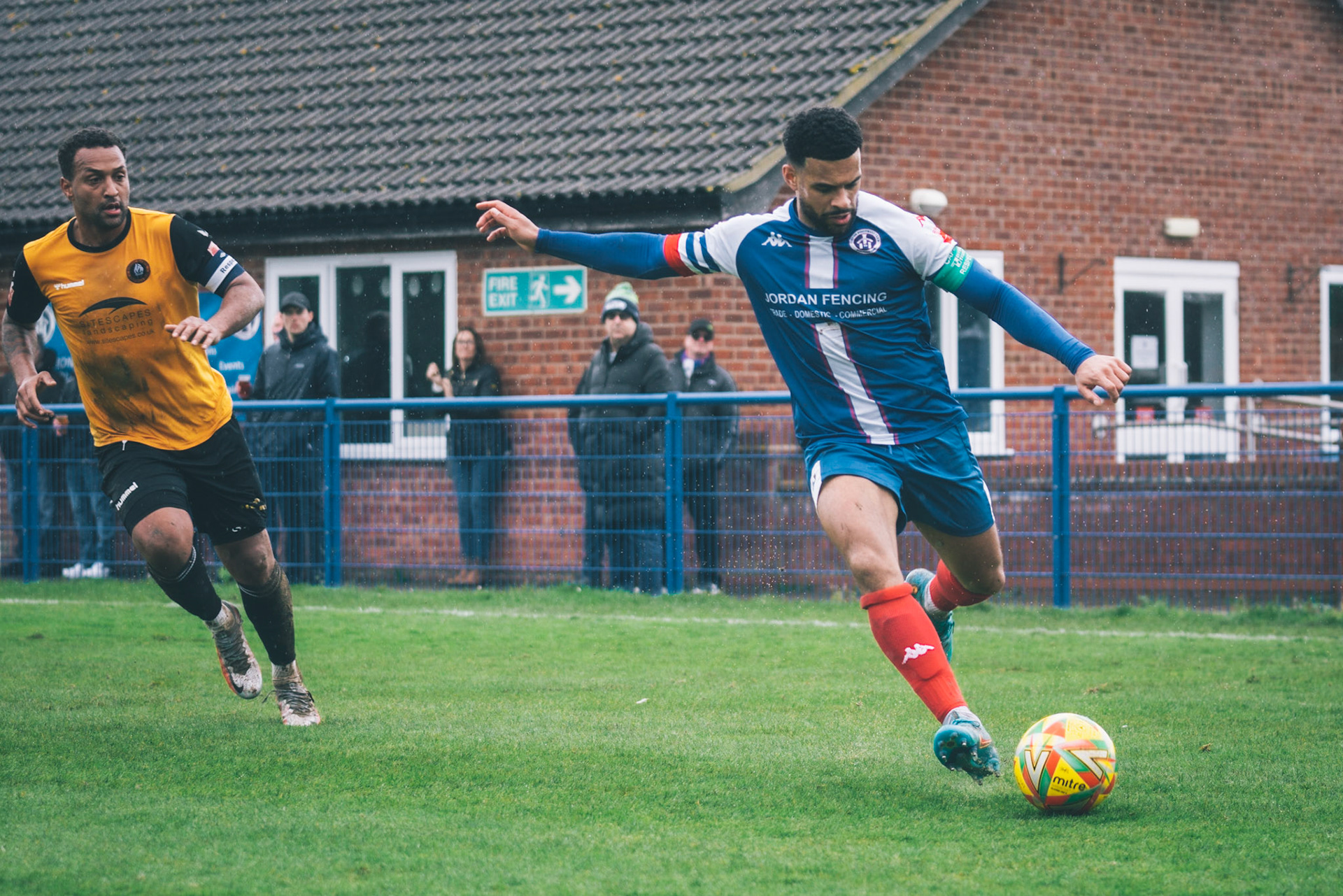 Leiston captain Seb Dunbar crossing a ball into the box