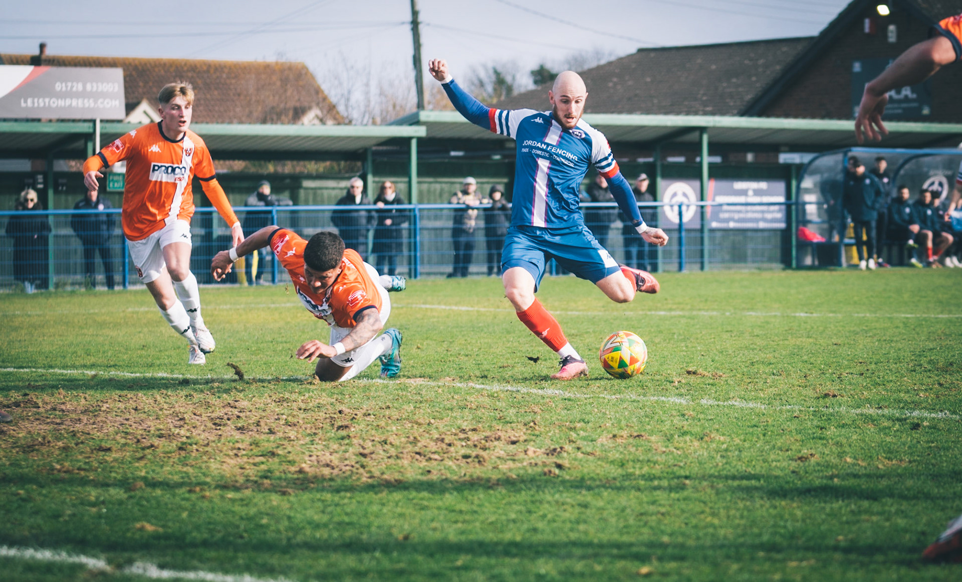 Adam Mills striking the ball with the stratford g.k pulling off a good save to keep it 0-0