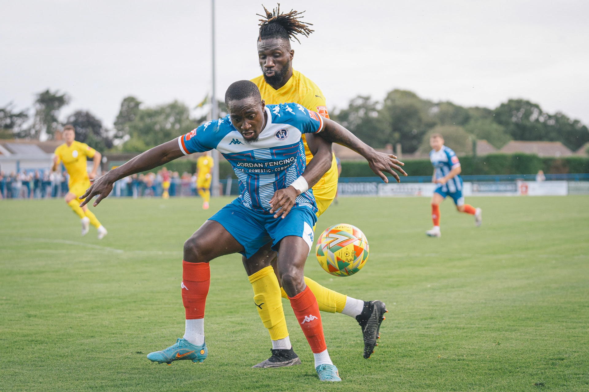Jama Loza holding off telford defender