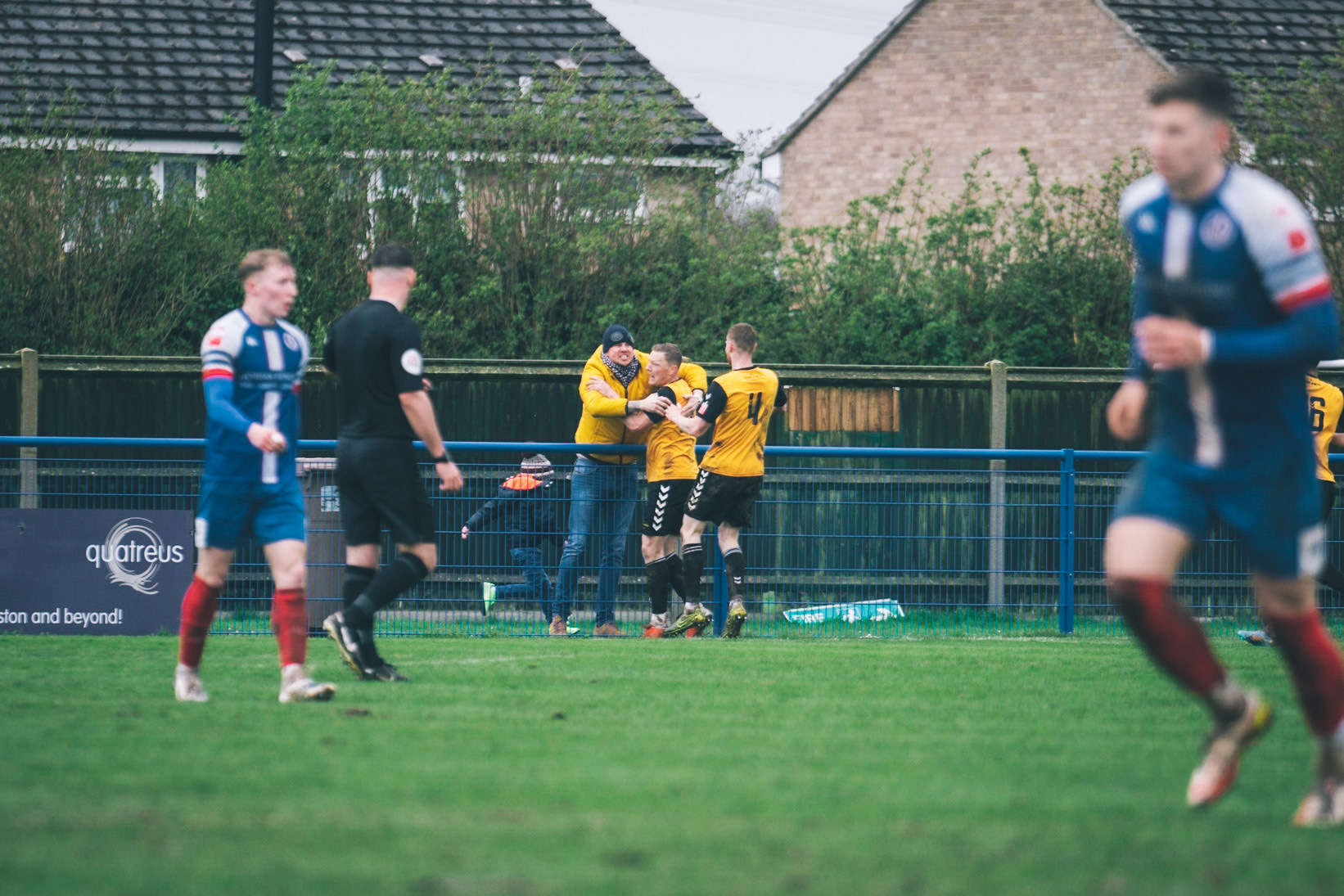 Rushall celebrating with a fan after making it 1-1