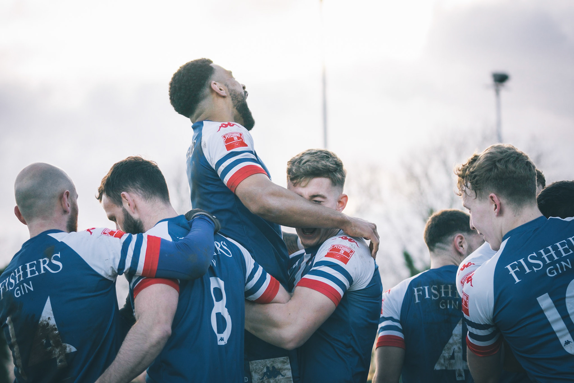 Leiston celebrating with Captain Seb Dunbar leaping on top of goal scorer Will Davies