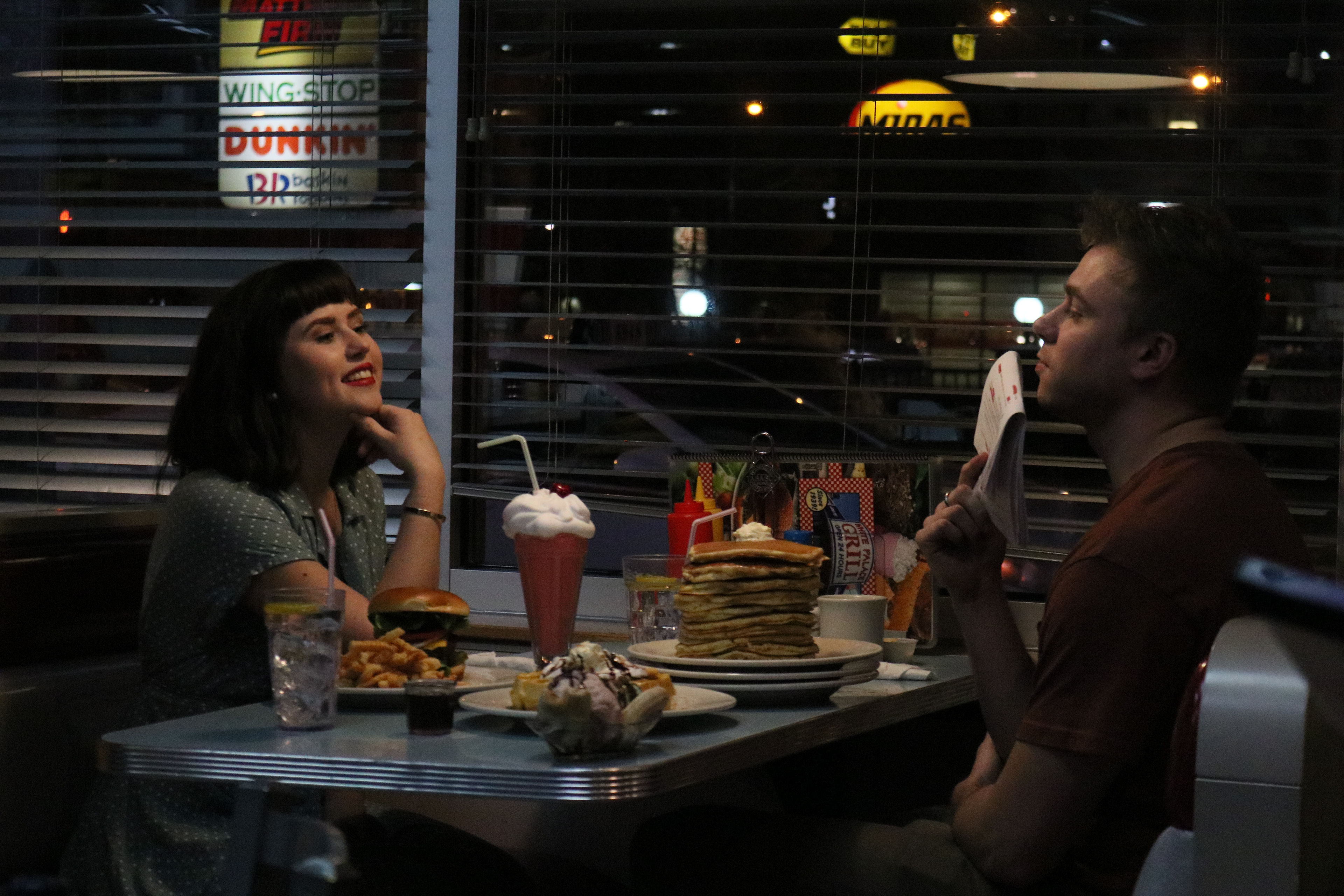 Mikala Scheel and Cody Hilliard on a diner set in "What Could Be" in Chicago