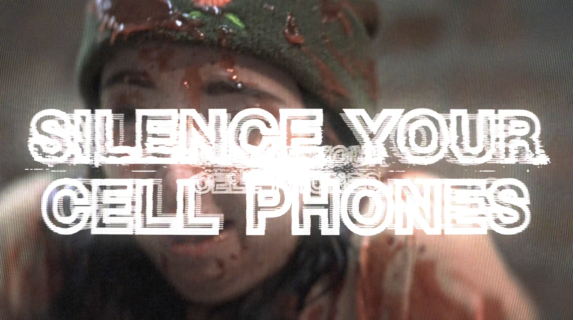 "SILENCE YOUR CELL PHONES" animated CRT text in front of Claire Sundbye covered in fake blood in "Laughing Since '79" commercial advertisement, preshow presentation, and parody of the AMC Theaters Nicole Kidman "We Make Movies Better" Advertisement for The Laugh Factory by Carpe Noctem Films