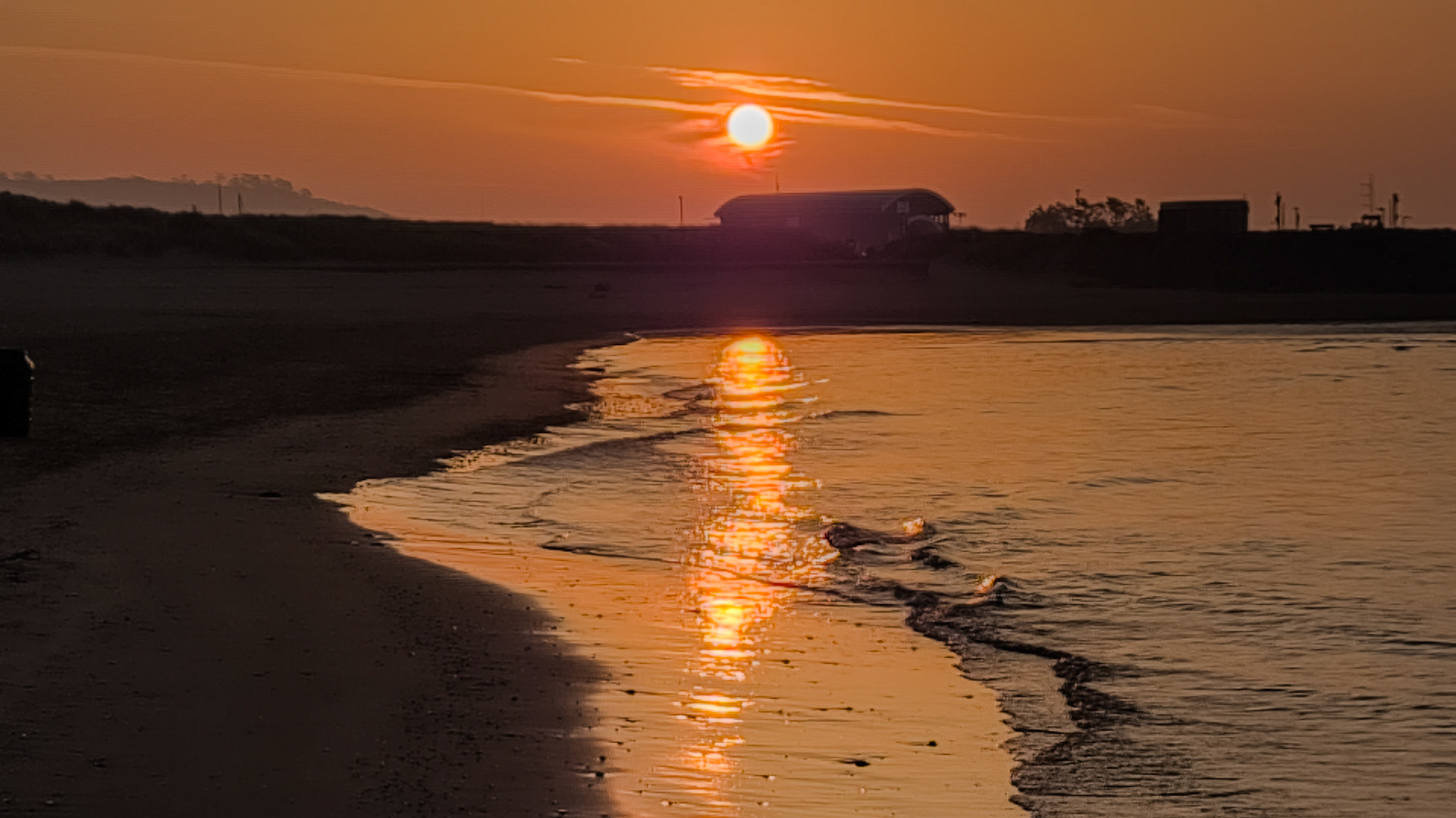 Sun rising over Burry Port RNLI statio