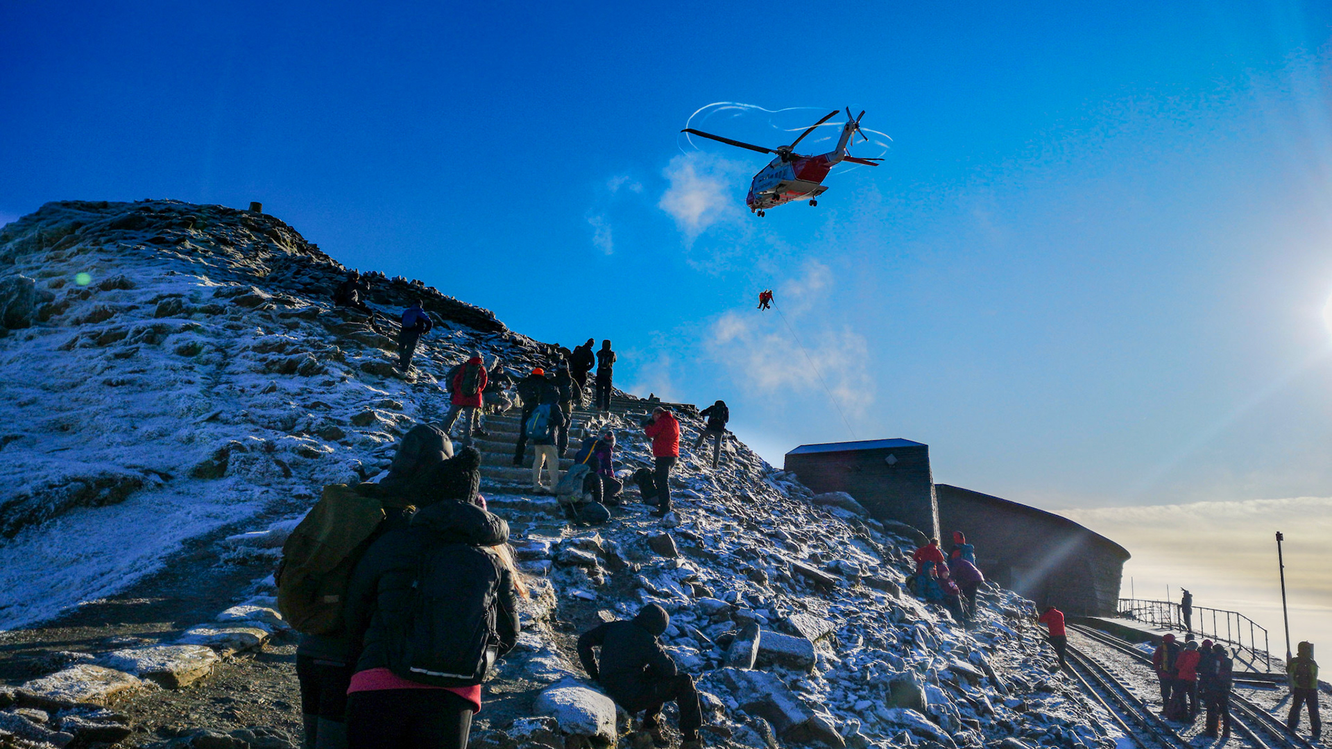 Lady with broken leg being rescued, very windy and cold!