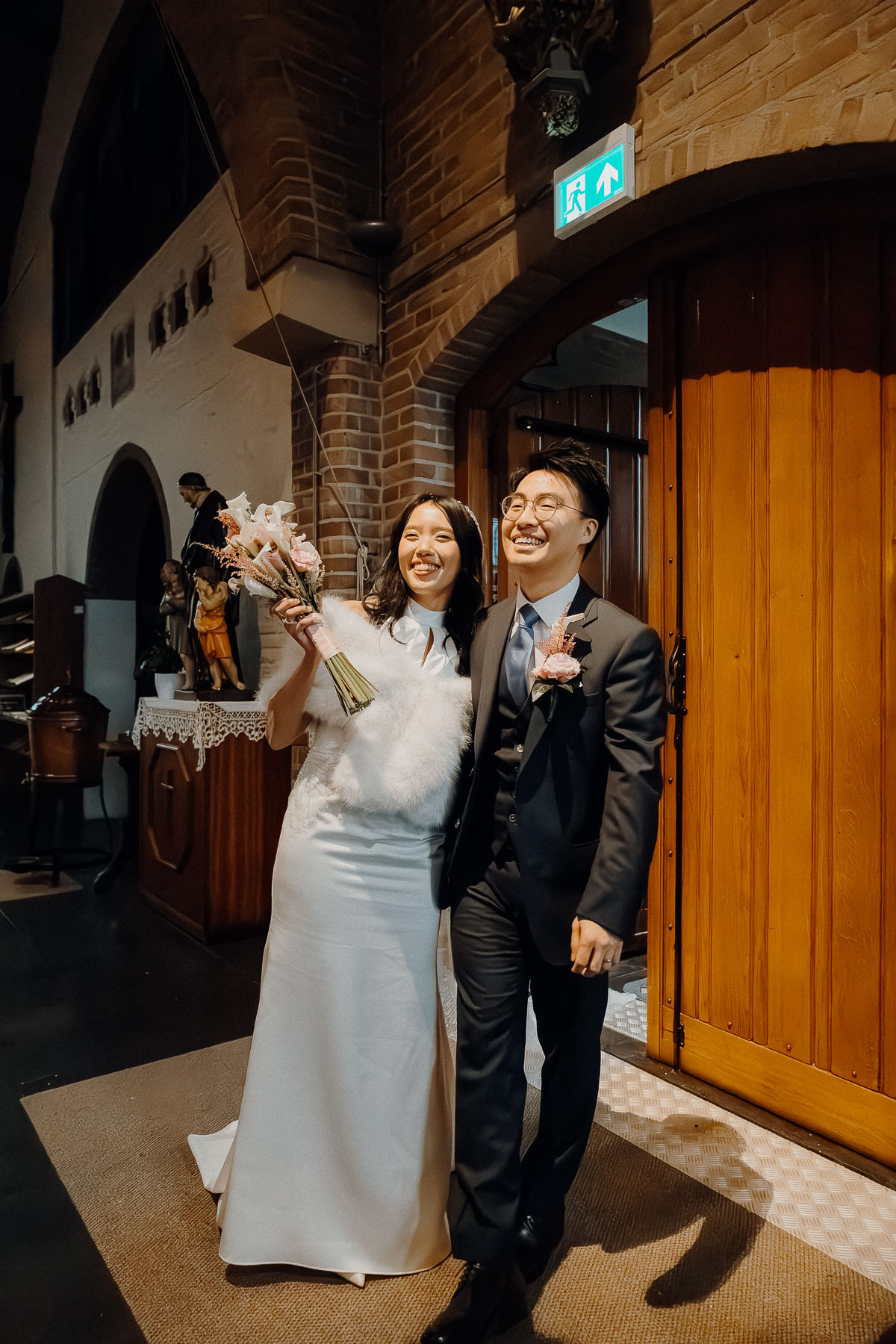 Bride and groom smiling and celebrating this milestone.