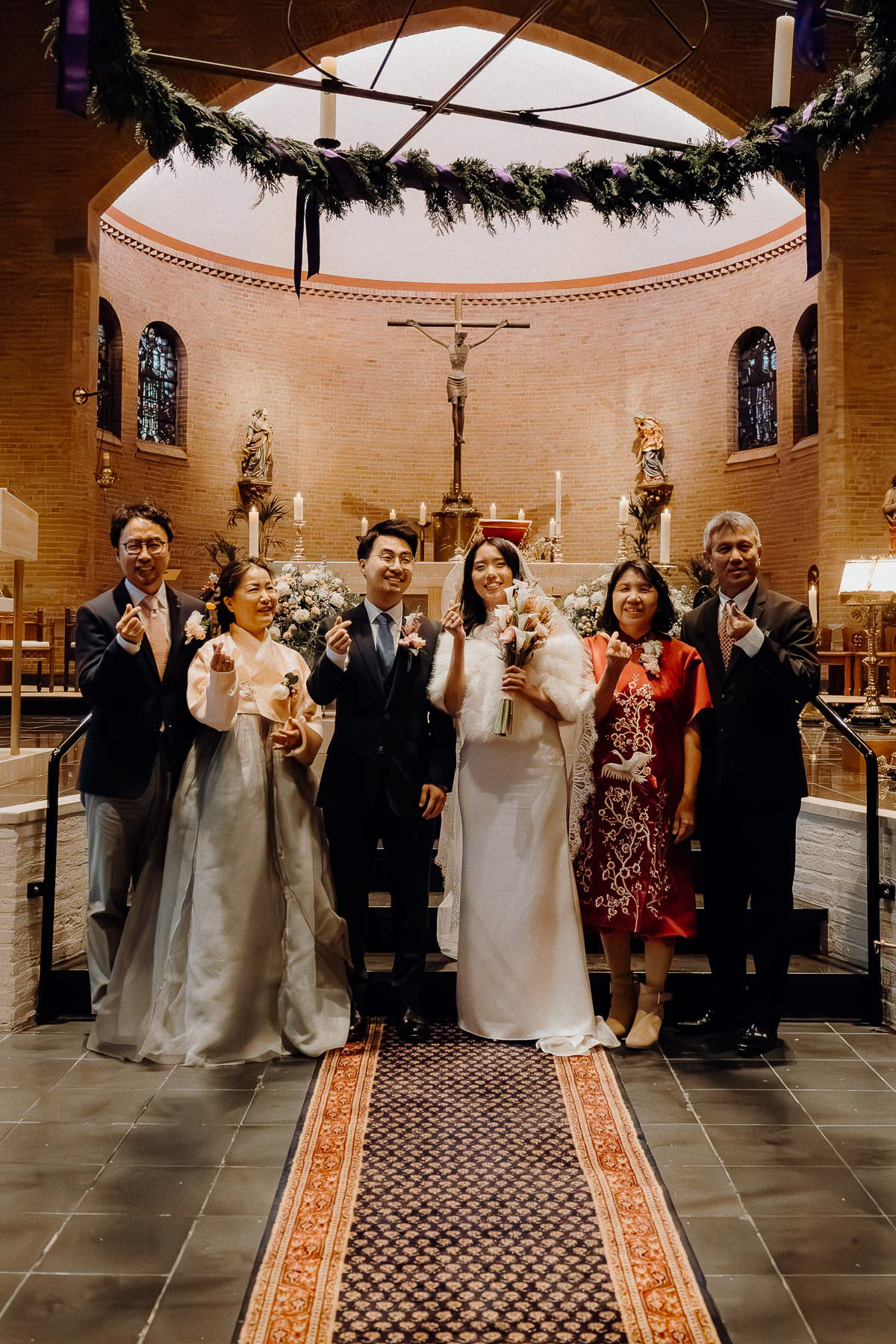 Group photo of the wedding of an Indonesian and Korean couple, taken by Amsterdam wedding photographer.