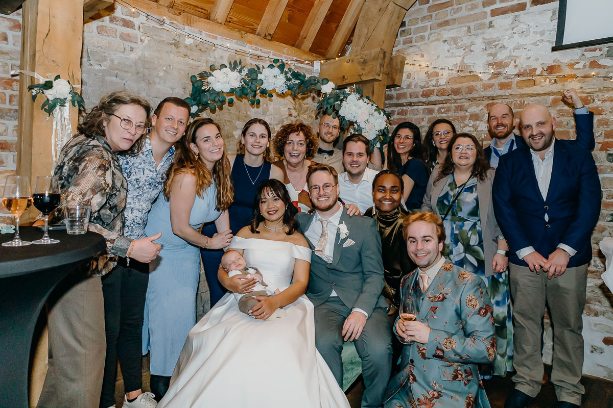 Family group photo at the wedding of a mixed couple.