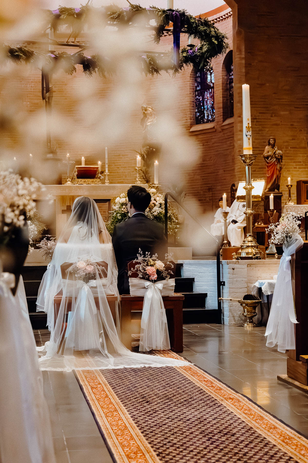 Bride and groom sitting down for their wedding ceremony.