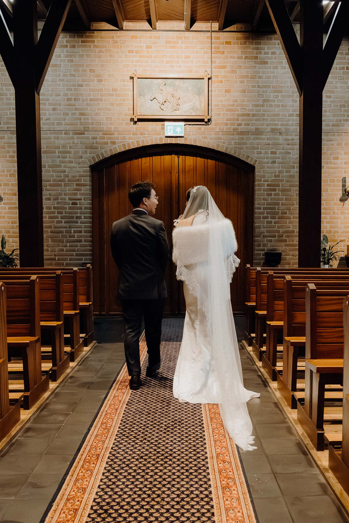 Bride and groom having a great chat as they walk out.