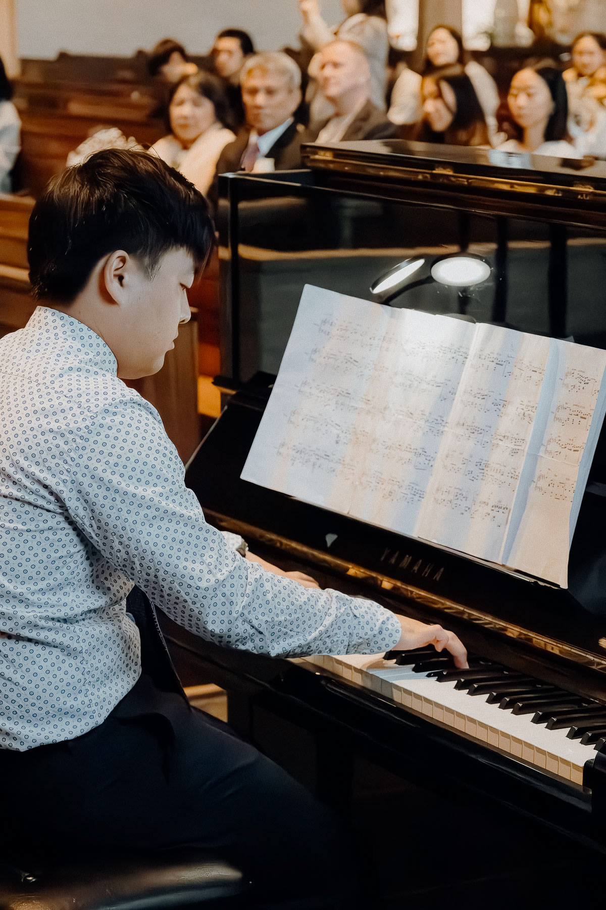 The groom's brother playing the piano for his brother wedding in Eindhoven.