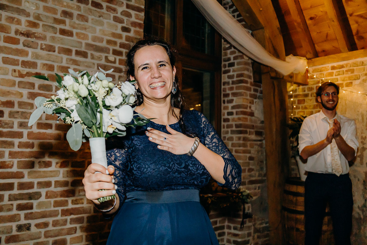 The lucky bachelorette who caught the bouquet.