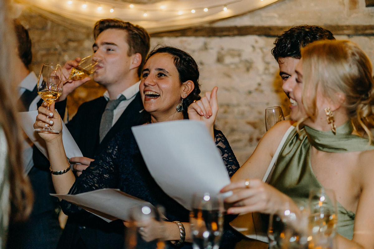 Guests singing joyously at the wedding.