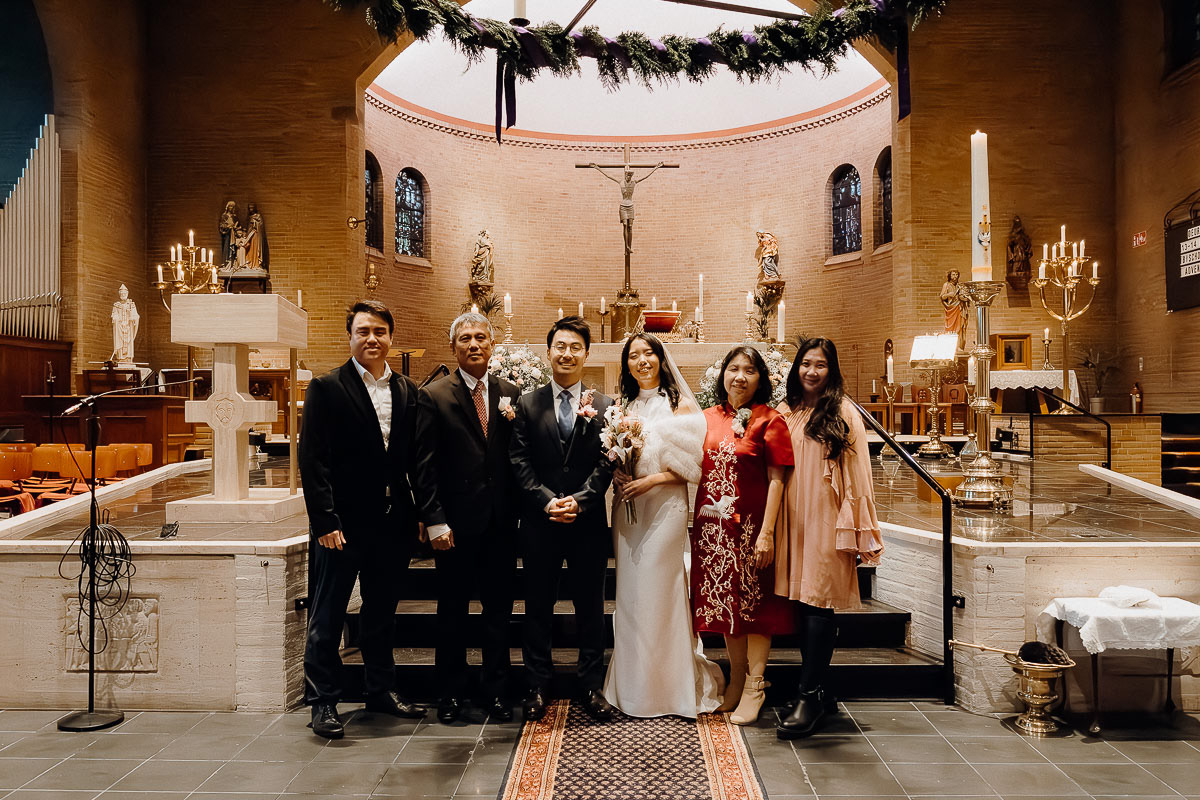 Group photo of the Indonesian family at a wedding.