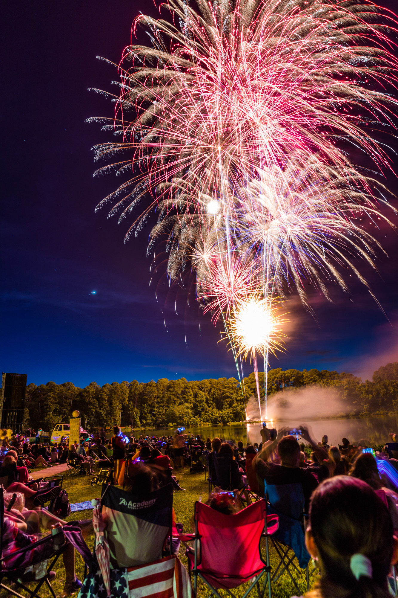 Thousands of Lufkinites watch in awe as fireworks light up the night sky during a Fourth of July celebration held at Ellen Trout Zoo Wednesday night, July 4, 2018, in Lufkin, Texas. (Cara Campbell/The Lufkin Daily News)