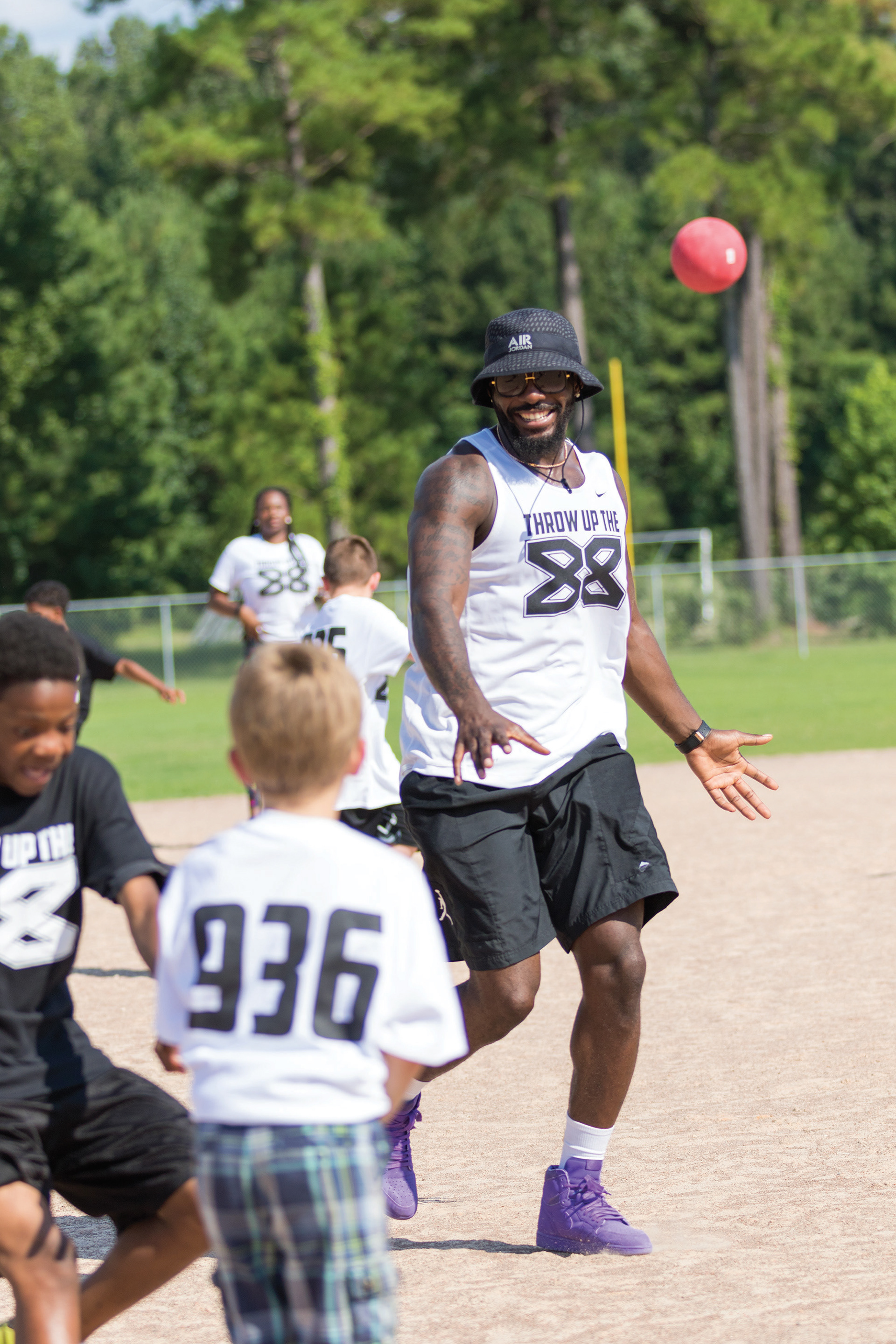 Dez Bryant, Dallas Cowboys wide receiver and former Lufkin Panther standout, runs the bases during a kickball game with Lufkin residents during a summer barbecue bash at Kit McConnico Park Thursday afternoon, July 20, 2018 in Lufkin, Texas. Bryant threw the bash as a "thank you" to his fellow Lufkinites before the upcoming 2017 football season. (Cara Campbell/The Lufkin Daily News)