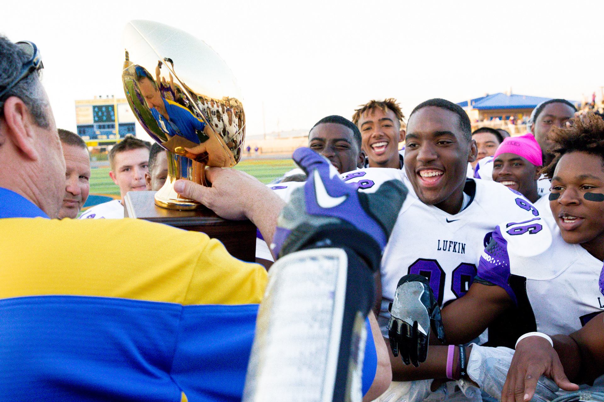 Lufkin Panthers are all smiles while accepting their area round trophy following their game win against Richardson Pearce Saturday, November 25, 2017, at Tiger Stadium in Corsicana.