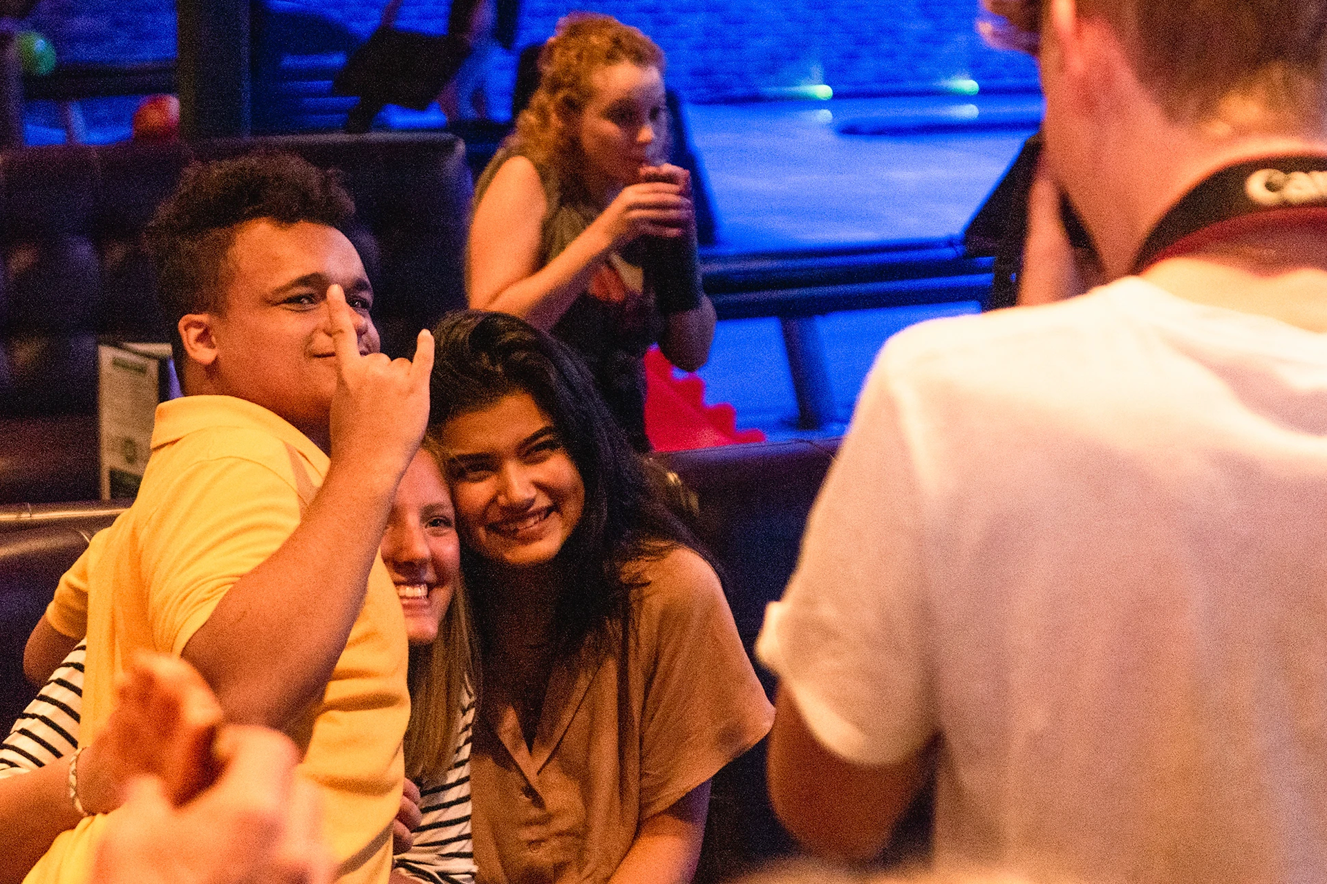 Robert E. Lee High School special education student Xavier Morris (left) and general education students Chloe Russell and Karime Ramirez sit for a photo during Buddy Bowl Thursday at Time Square Grand Slam bowling alley in Tyler. (Cara Campbell/Tyler Morning Telegraph)