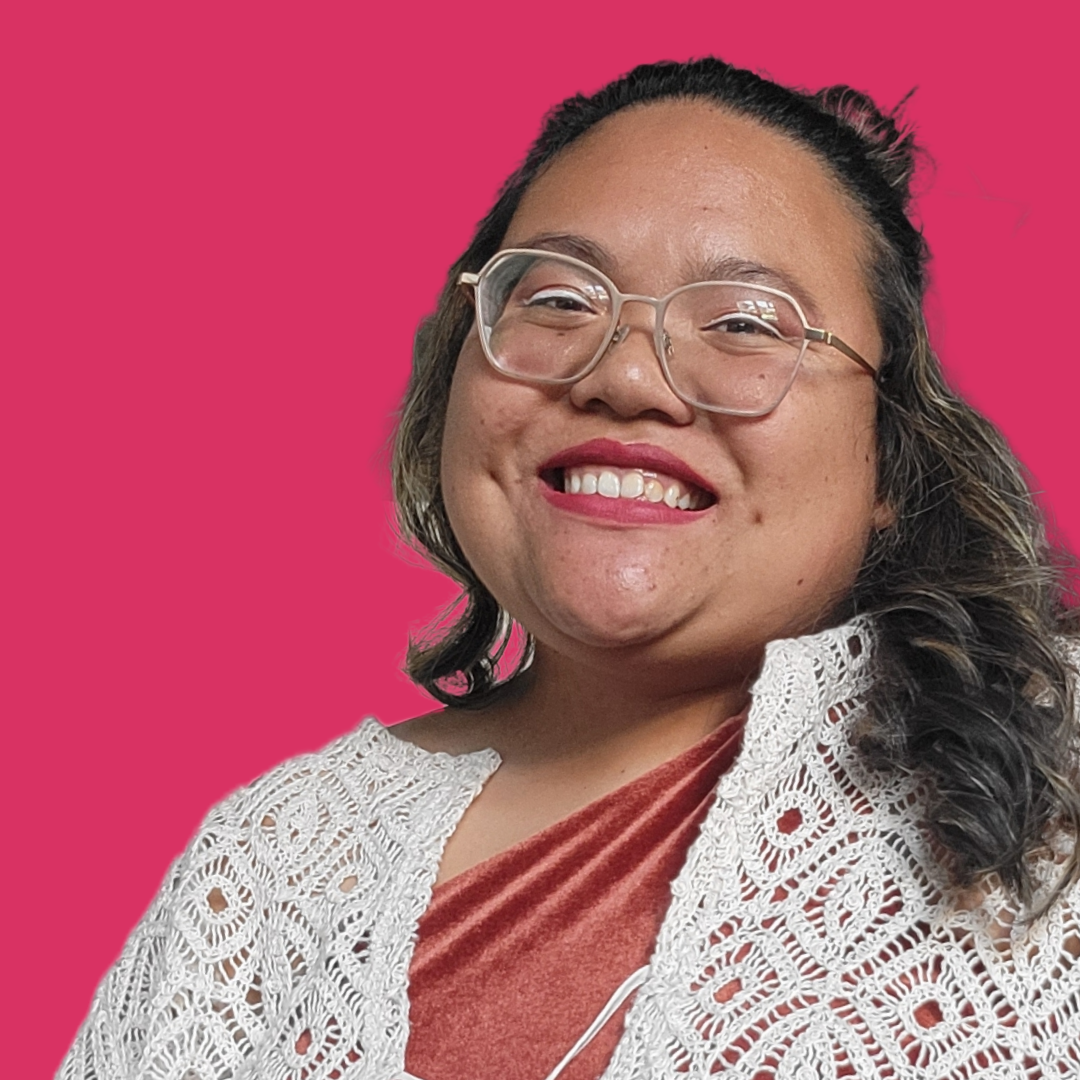 a smiling individual is featured against a bright fuchsia background