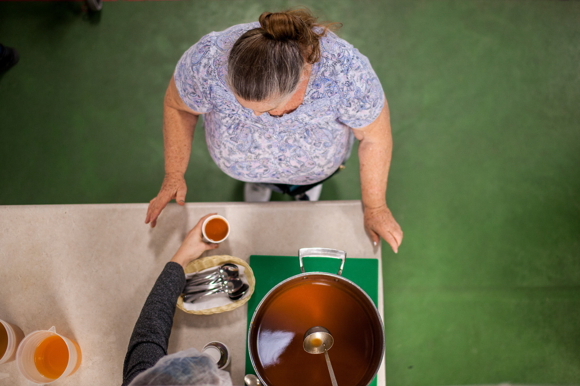 BRANTFORD, Ont.--March 24, 2019 - A diner receives a helping of tomato soup from volunteers at the Syndenham Sunday Supper Club at Sydenham St. United Church