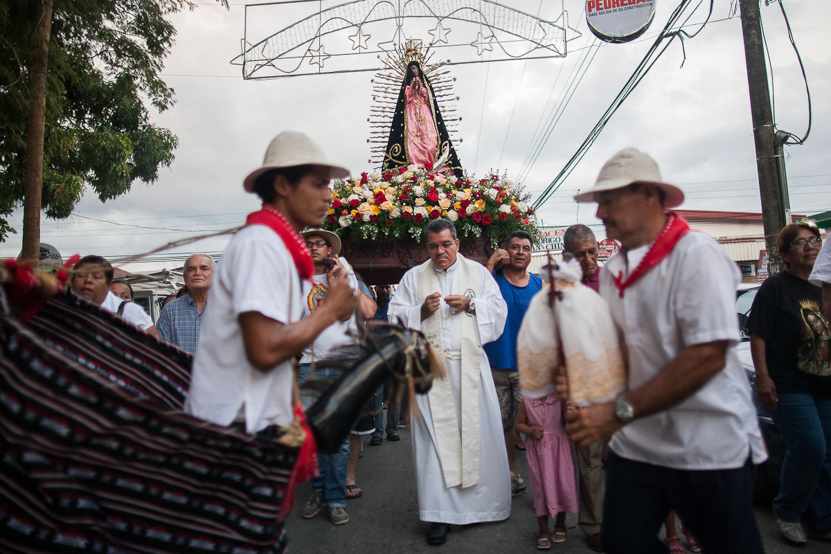NICOYA, Guanacaste Prov., Costa Rica--Dec. 12, 2012 - Dancers perform in front of clergy and members of the Brotherhood of the Virgin of Guadalupe of Nicoya as they parade in an annual tradition, one of many to the Virgin of Guadalupe in Latin America.