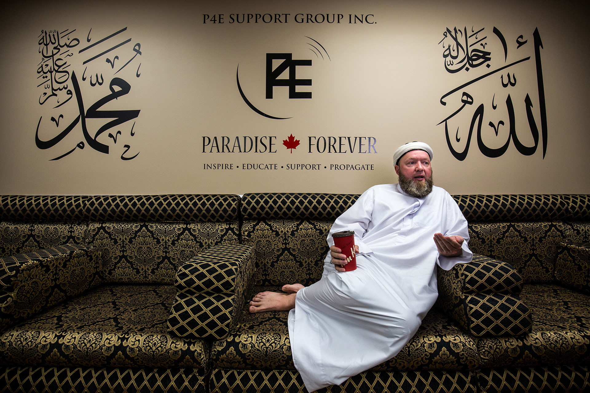 Muhammad Robert Heft sits speaking in the main room of Paradise Forever's Toronto location on Wednesday, August 19, 2015. Photo by Giordano Ciampini for The Calgary Herald