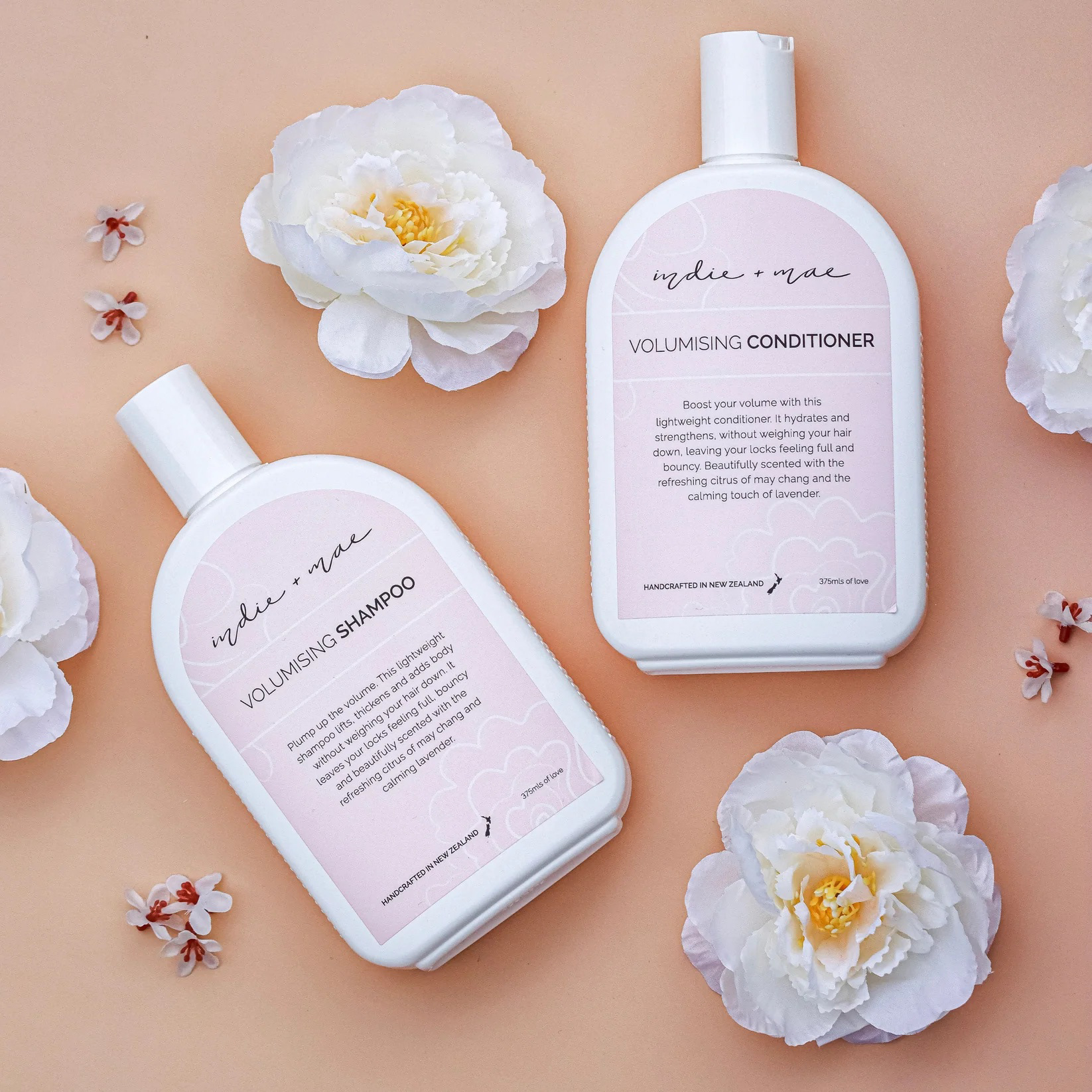 Indie + Mae peachy pink natural beauty packaging designed by Laura Fisher.