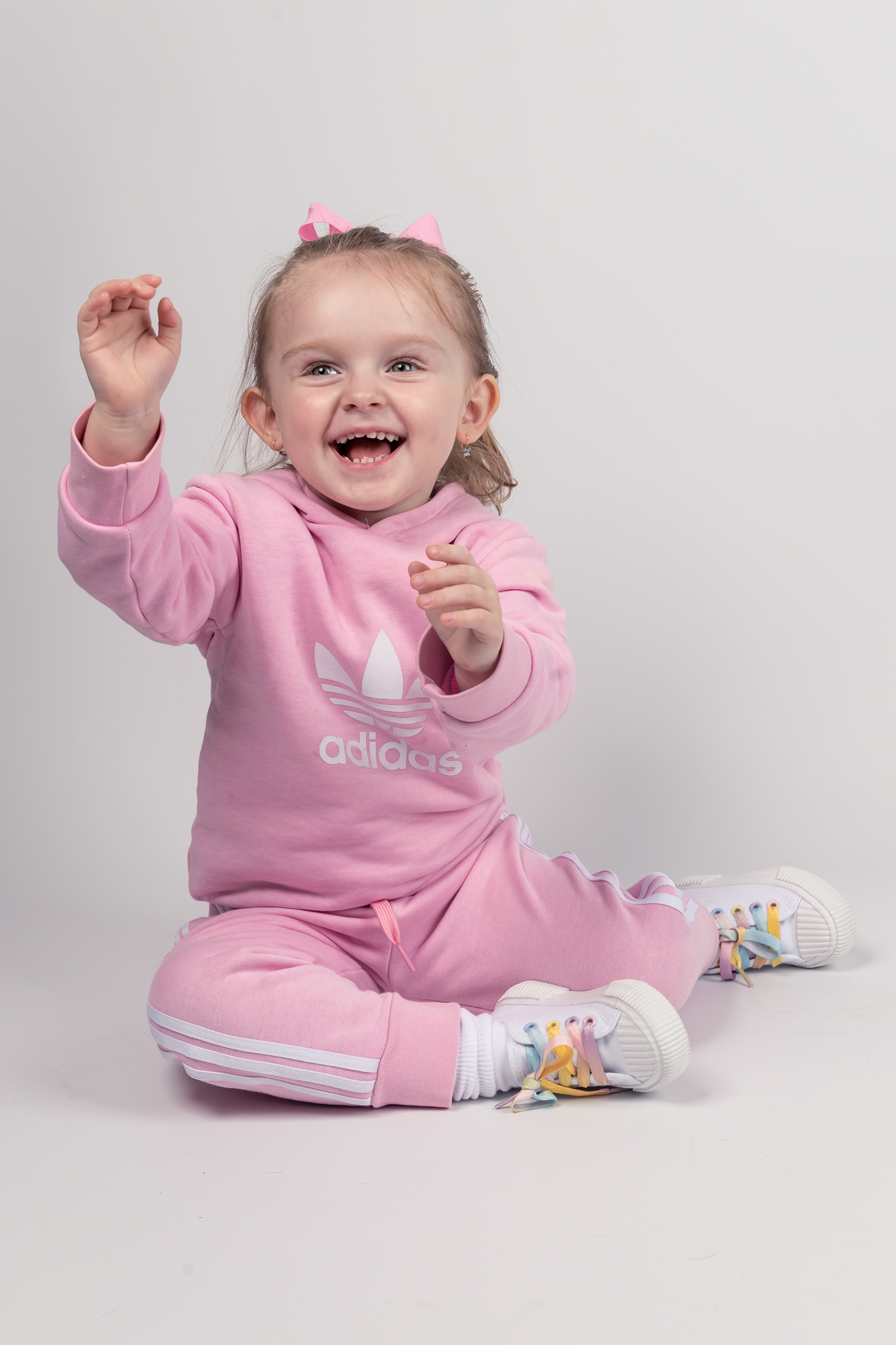 4 years old girl photo shoot in Bolton, Greater Manchester, pink tracksuit, white background