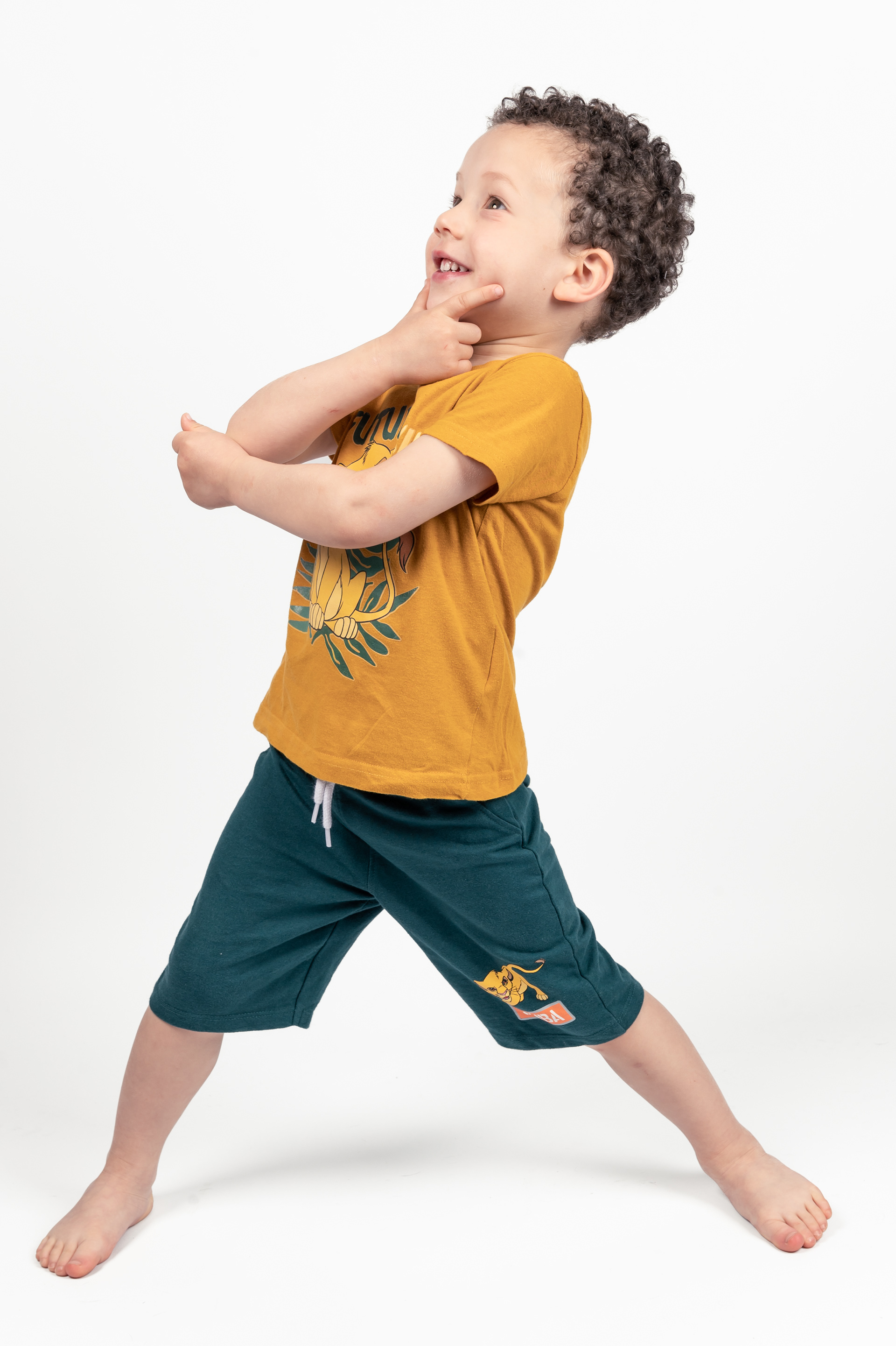 Young Boy Model Portfolio, Photo session, Bolton, Greater Manchester, orange top and green shorts