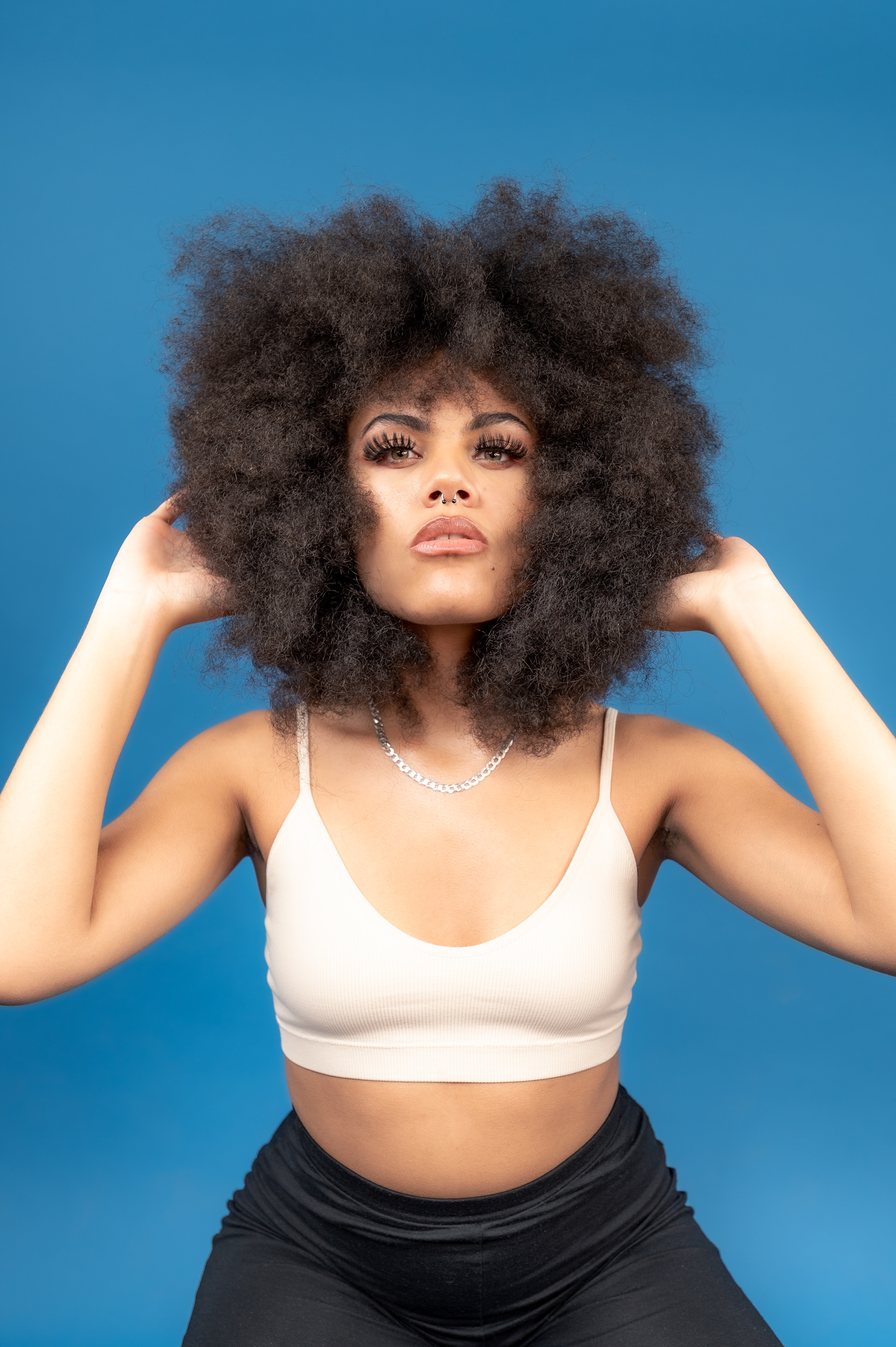 Model Photoshoot, Girl studio blue background, curly ebony photo session, afro hairstyle, Manchester 