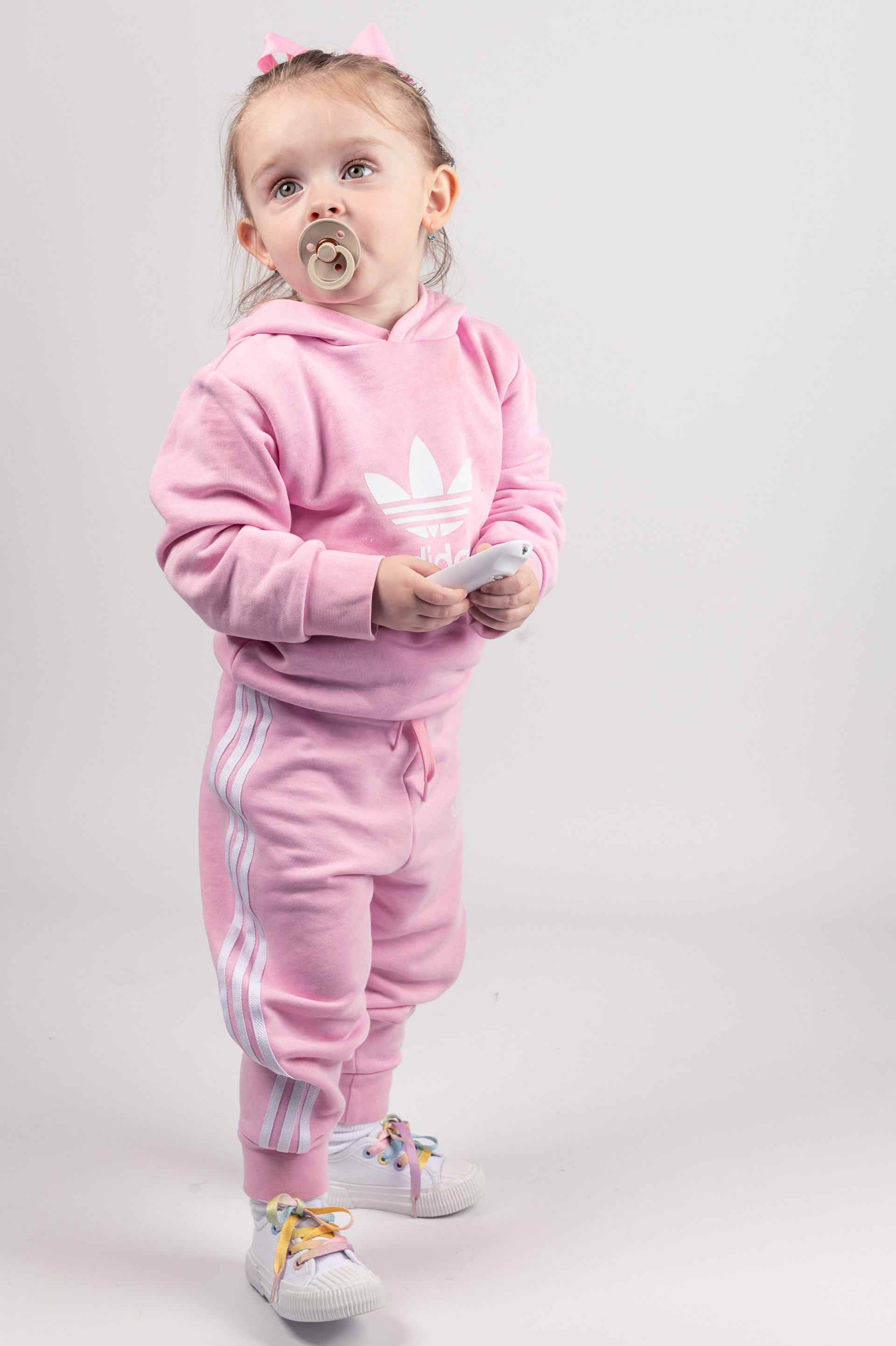 4 years old girl photo shoot in Bolton, Greater Manchester, pink tracksuit, white background