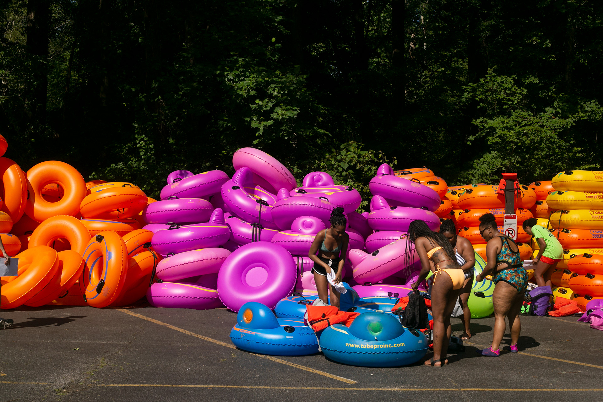 Women get ready to tube on the Chattahoochee River in Atlanta, Georgia, on July 4, 2021.