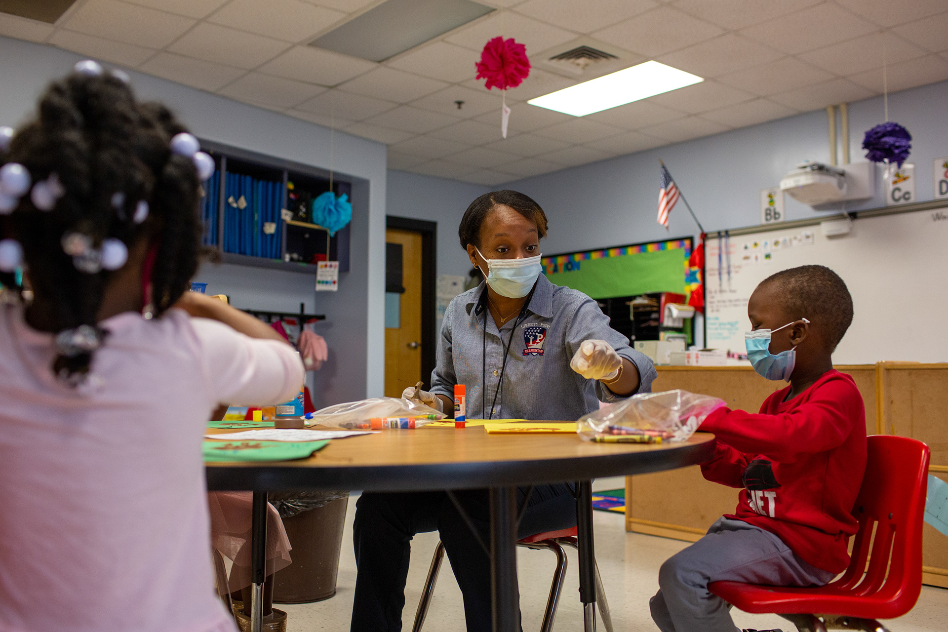 Ms. Micahiah Drake and Reign Smith work on their art projects about autumn at Liberty Point Elementary School in Union City, Georgia, on Friday, October 16, 2020.
