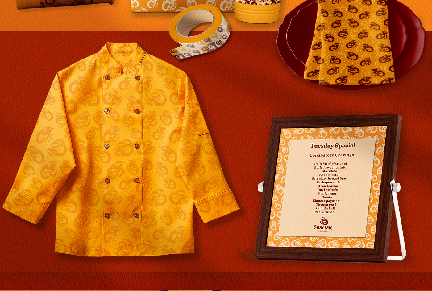 Snactale heritage snack bistro brand: chef jacket, patterned cloth and framed menu