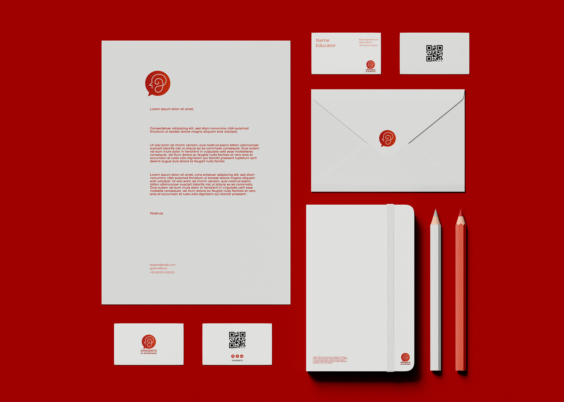 Gyancasts by Artpreneurs brand identity: stationery set with letterhead, envelope, cards and notebook on red