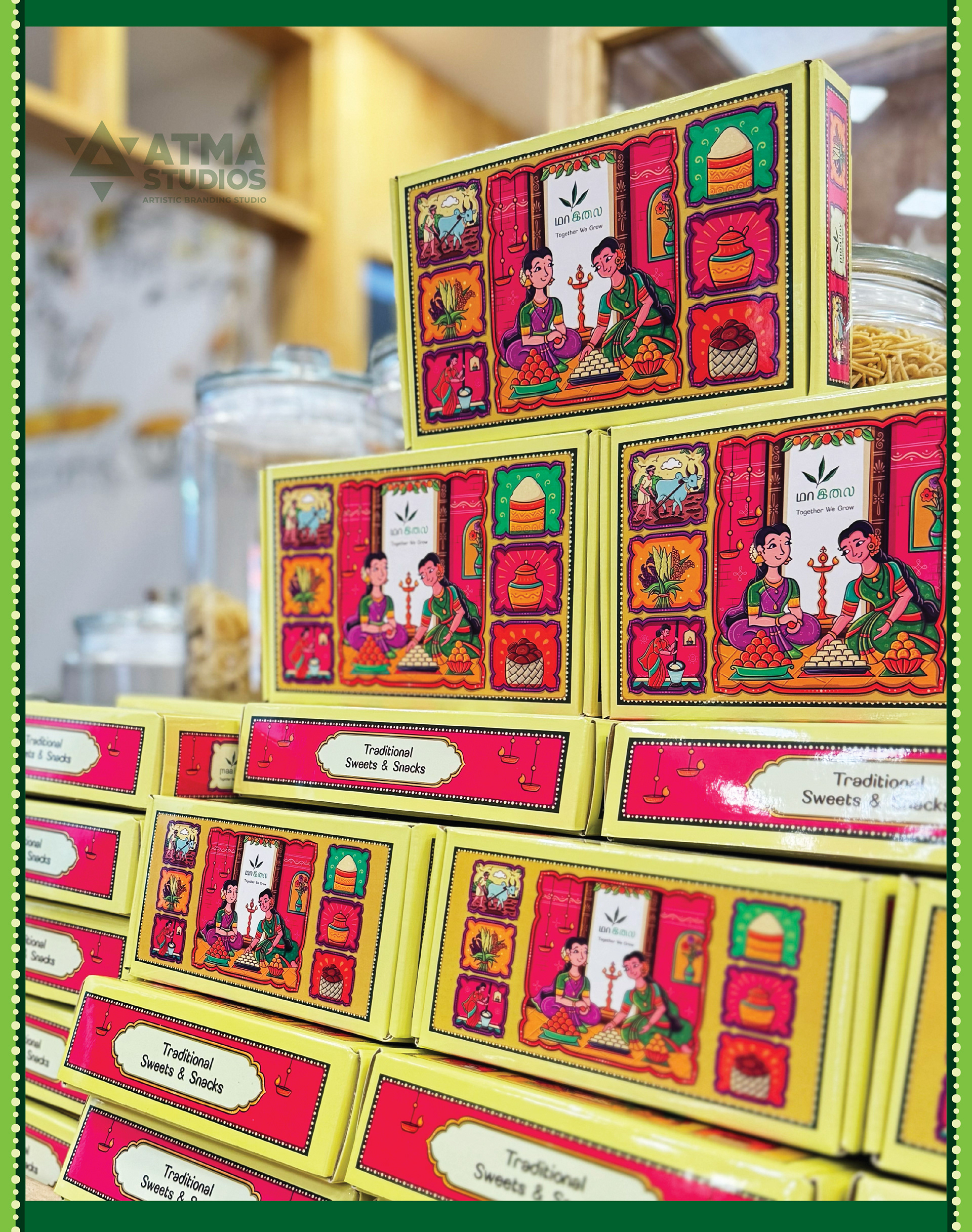 Maa Ilay illustrated sweet box package design: close-up of stacked sweet boxes on display