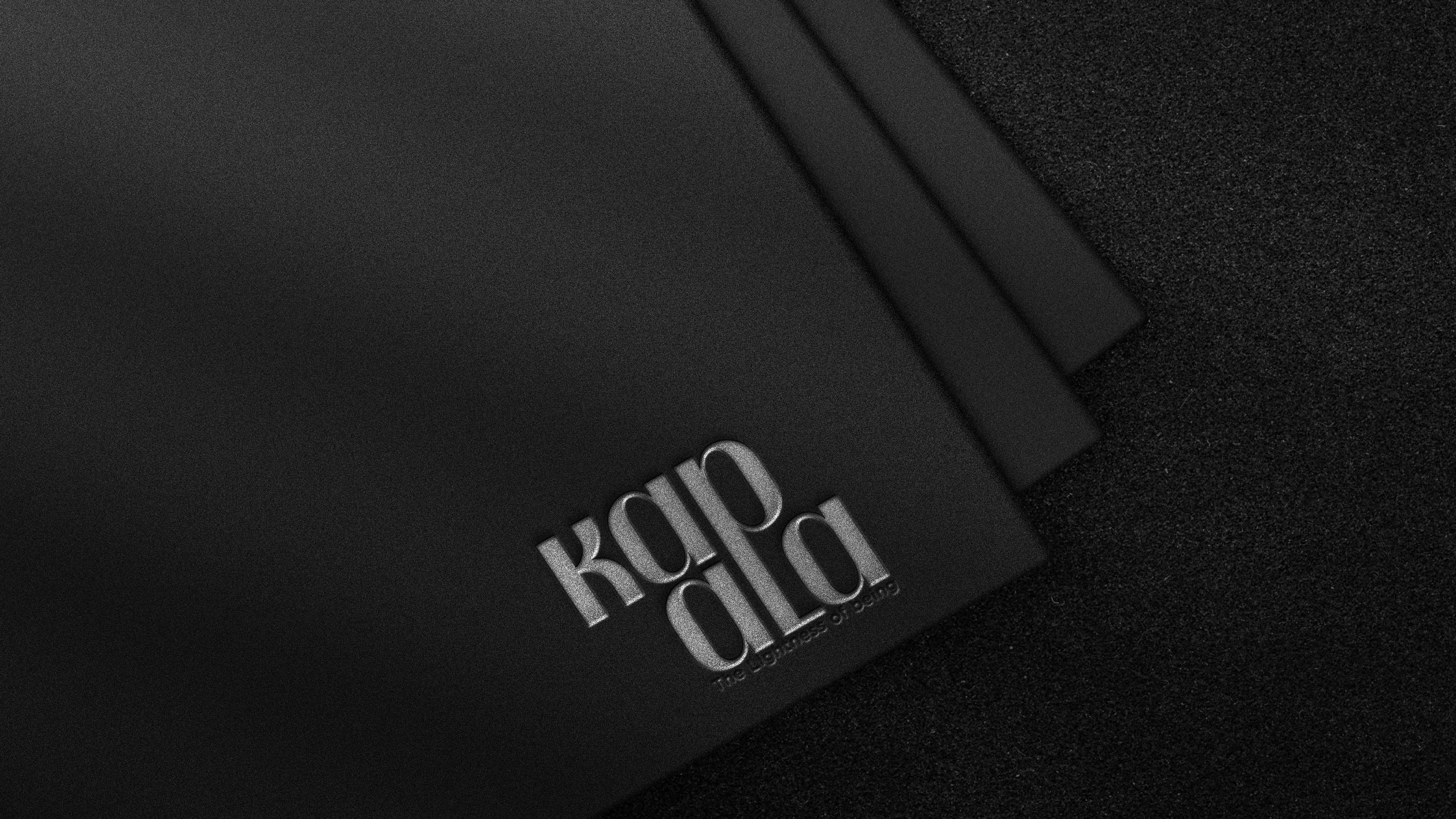 Kapala cycling brand identity: wordmark embossed on black paper