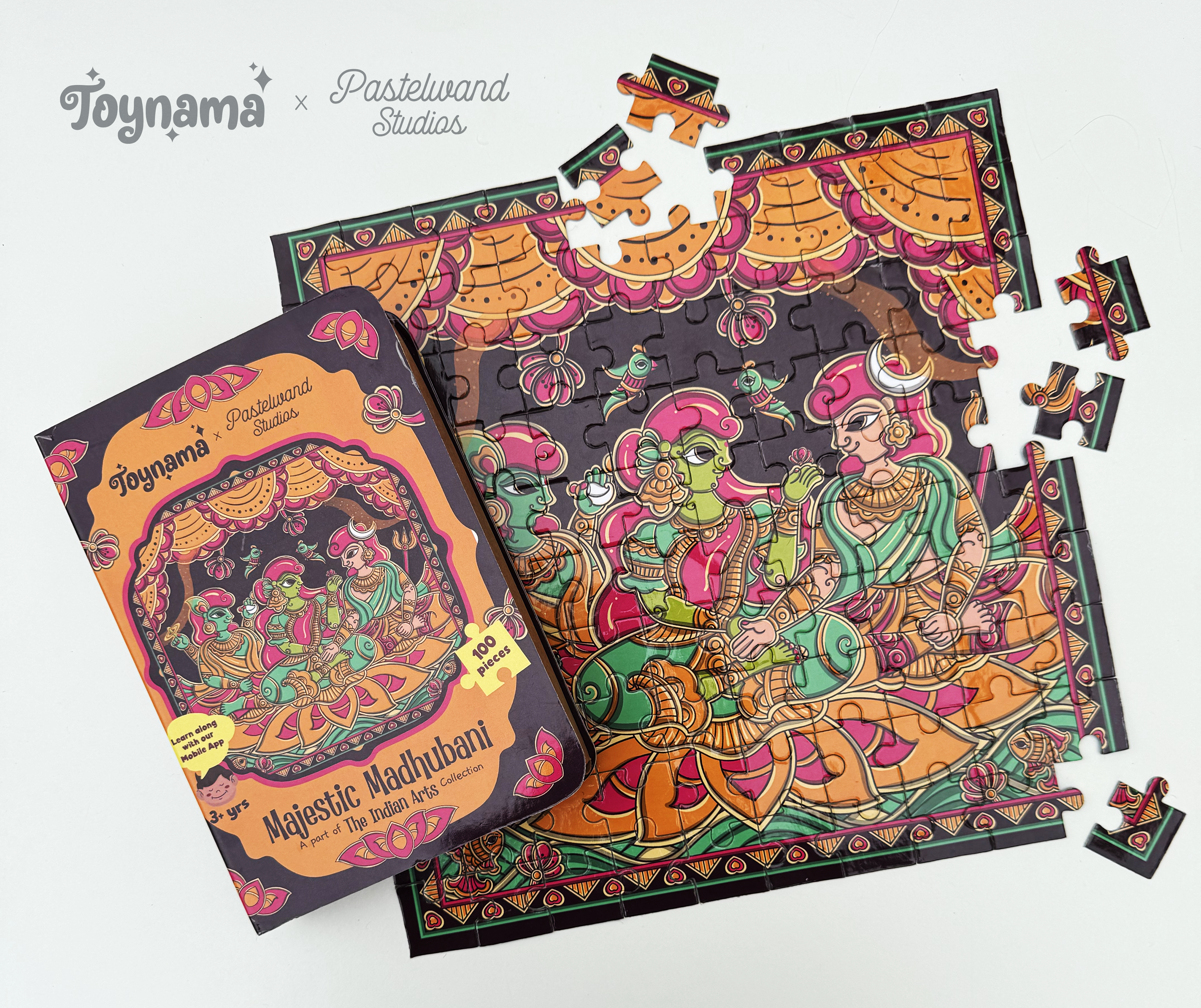 Arts of India jigsaw puzzles for Toynami: Madhubani jigsaw puzzle box with scattered pieces