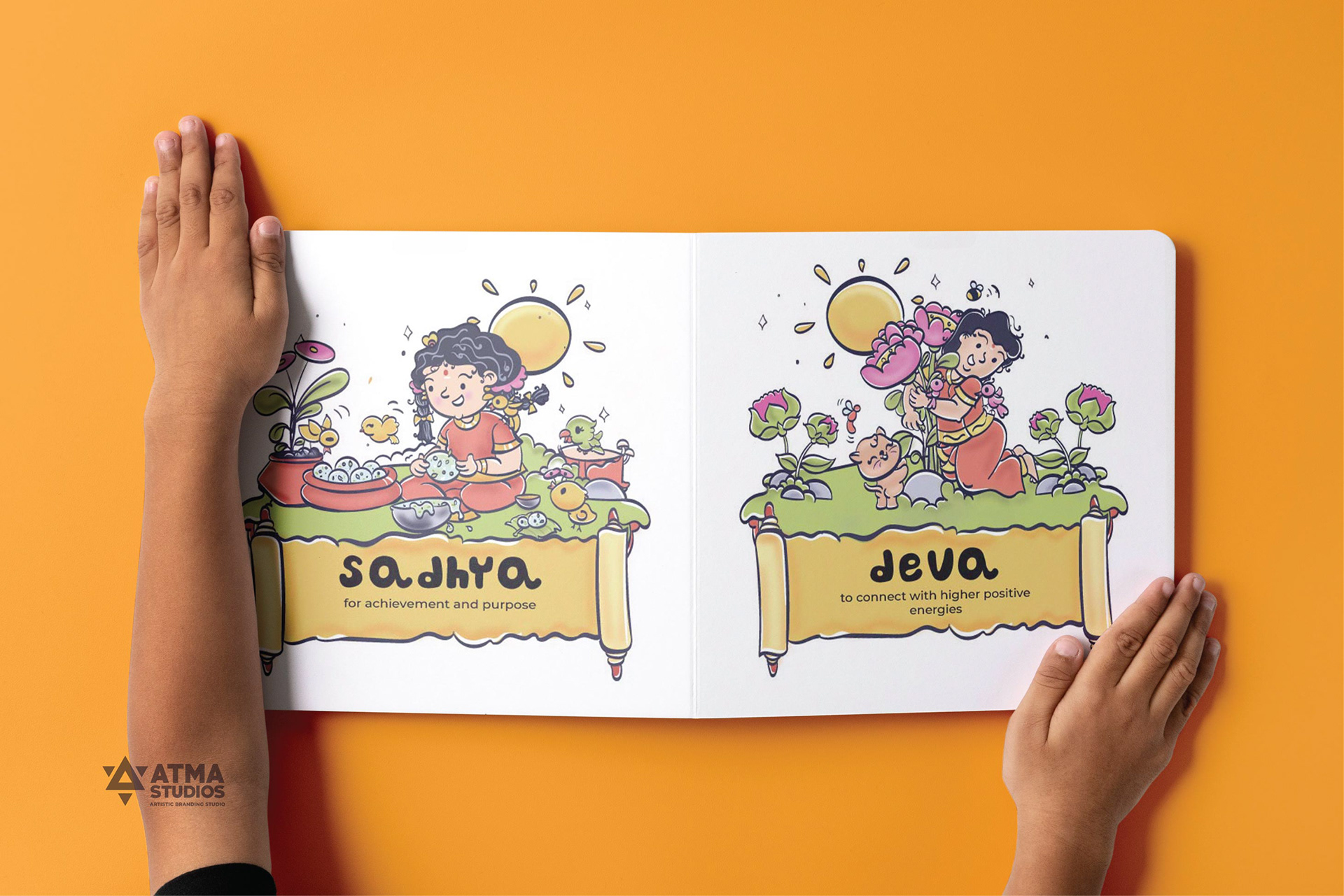 Illustrated Vedic mantras for children book: hands opening the book to Sadhya and Jeeva pages