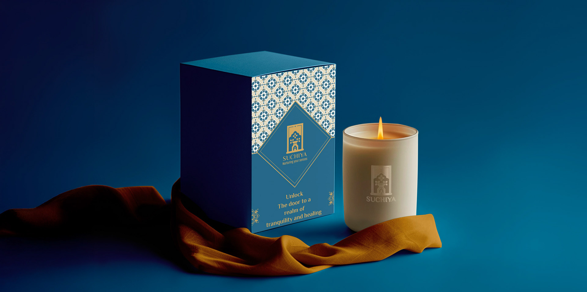 Suchiya home fragrances brand: candle box packaging beside a lit candle