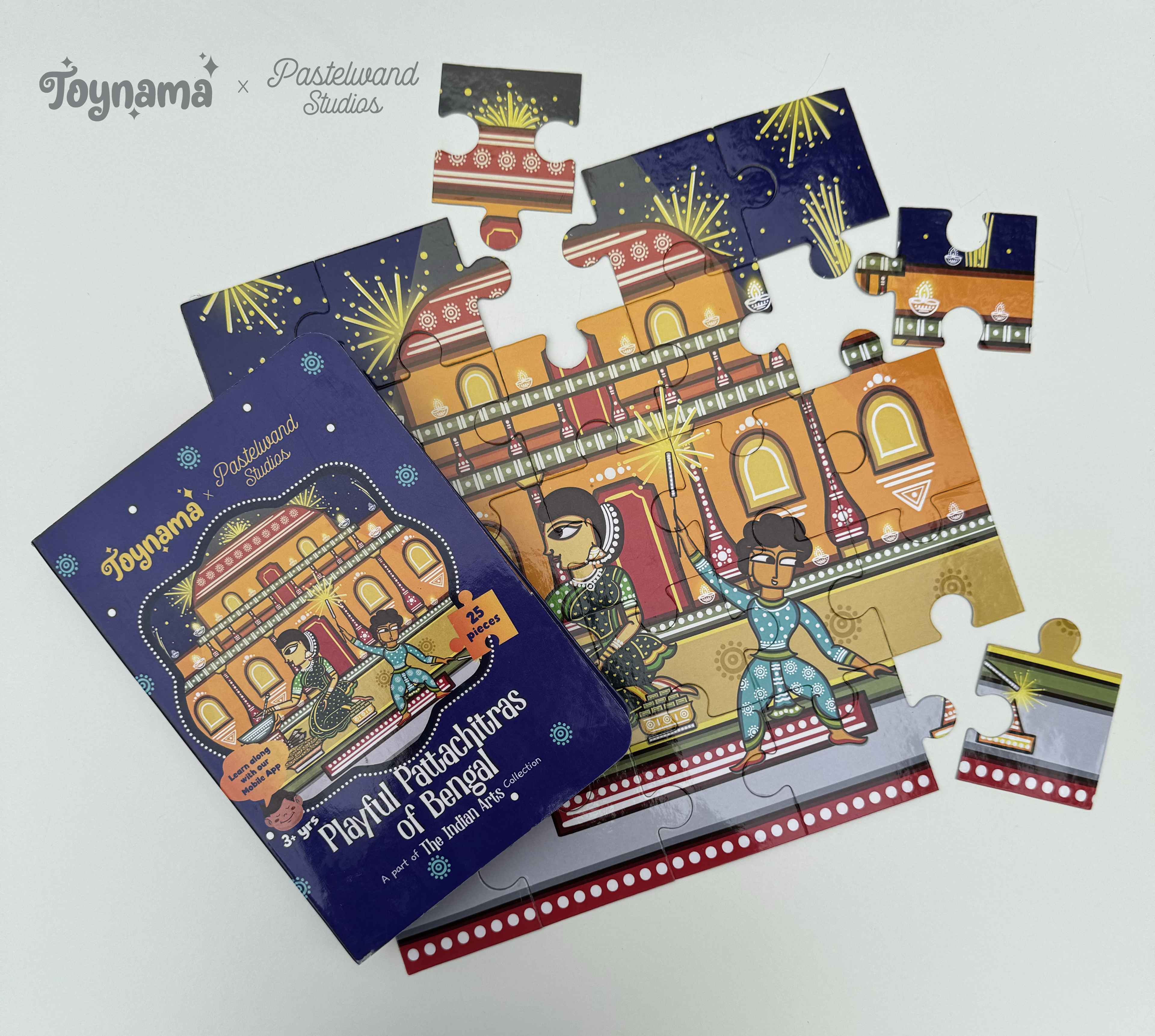 Arts of India jigsaw puzzles for Toynami: Pattachitra jigsaw puzzle box with scattered pieces