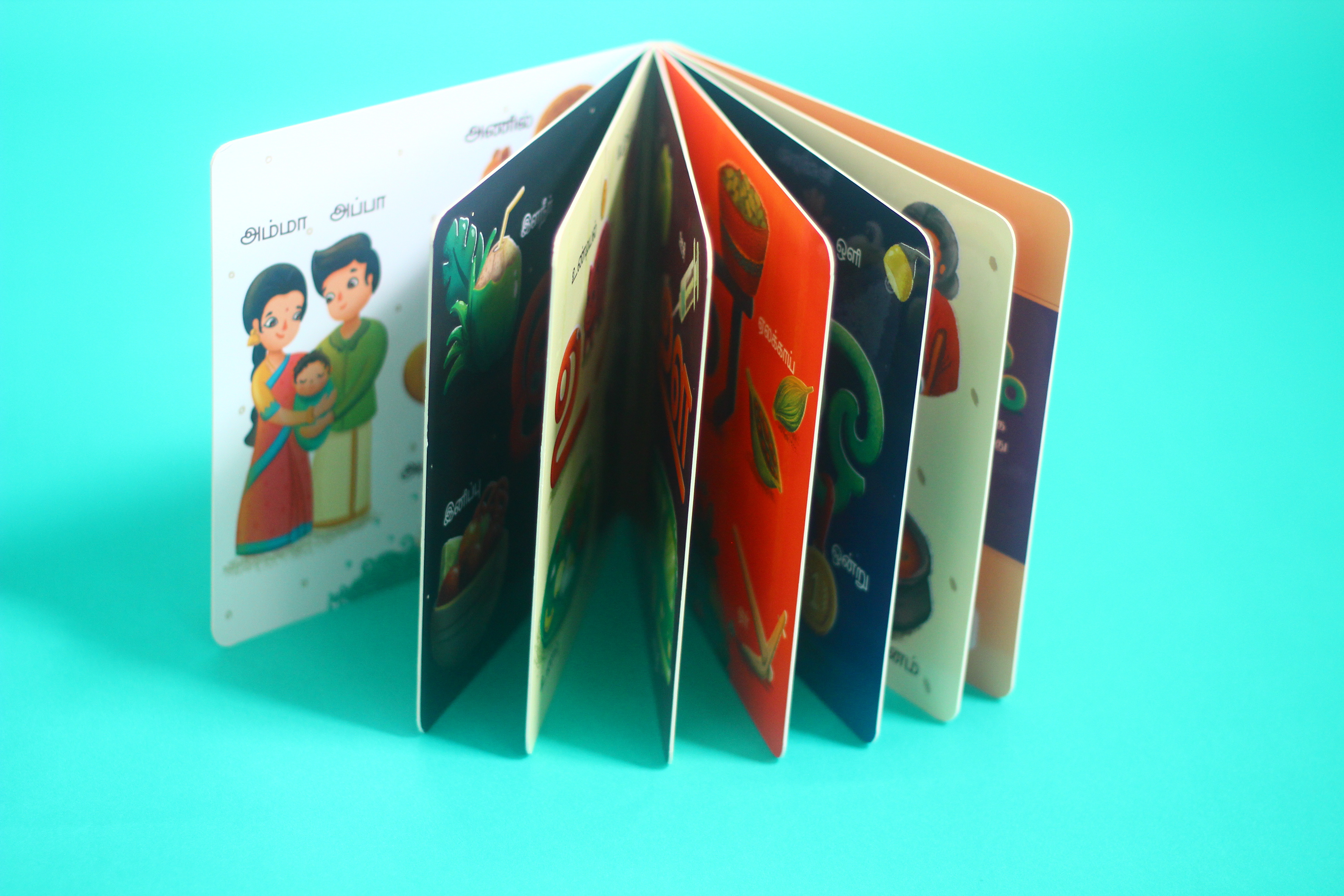 Uyirum Tamizhum Tamil vowels board book: board book pages fanned open